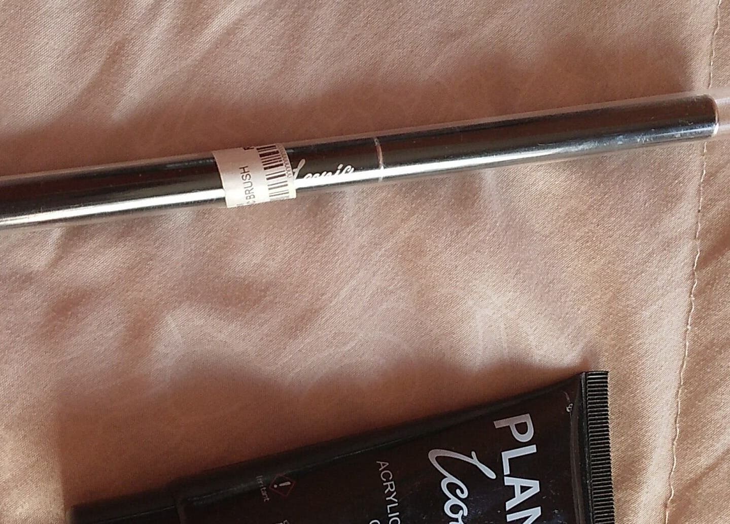 Makeup brush by Iconic at The Basic, Pretoria, Gauteng, ZA, on a soft fabric background.