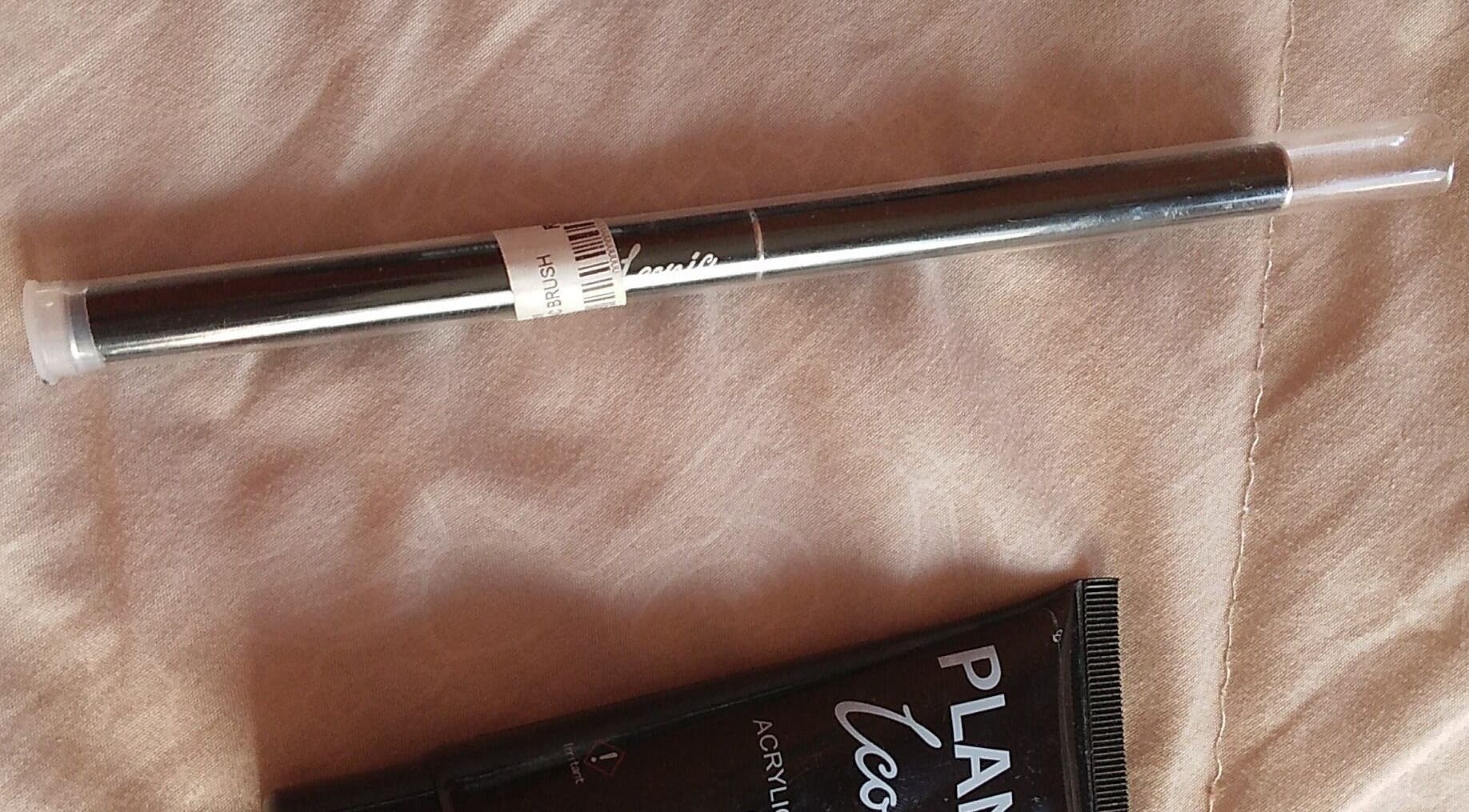 Makeup brush by Iconic at The Basic, Pretoria, Gauteng, ZA, on a soft fabric background.