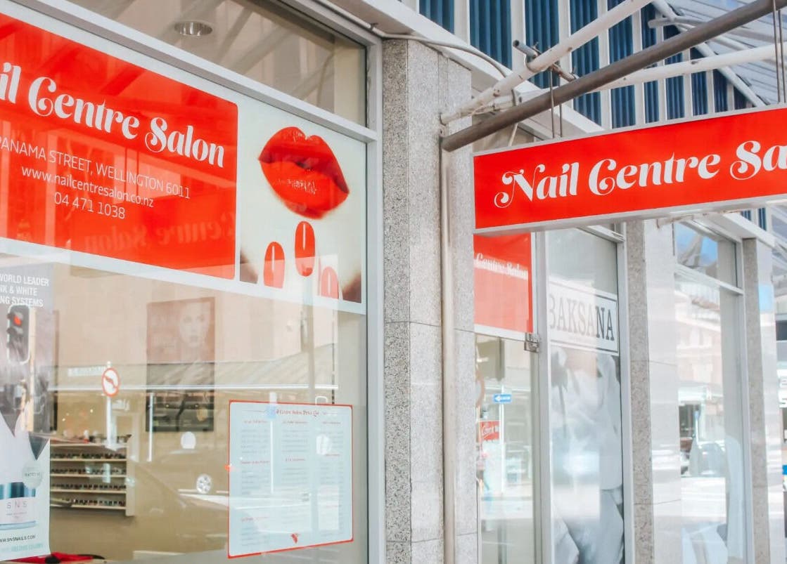 Bright exterior of Nail Centre Salon, Wellington, Wellington Region, NZ showcasing vibrant signage.