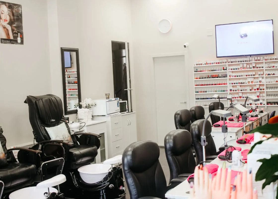 Nail Centre Salon, Wellington NZ interior showcasing manicure stations and pedicure chairs.