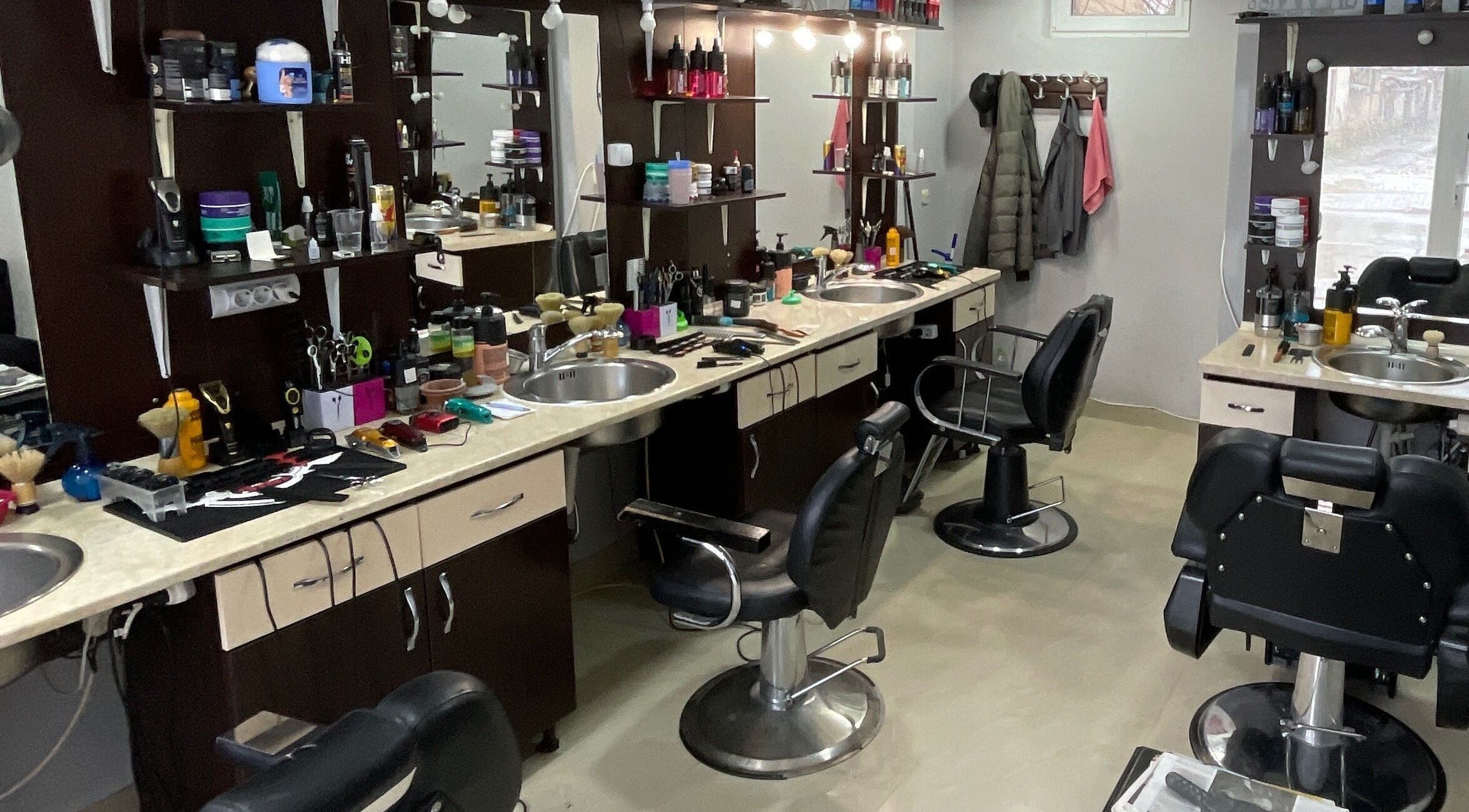 Stylish interior of Studio Kral in Ohrid, Municipality Of Ohrid, MK showcasing modern salon chairs and workstations.