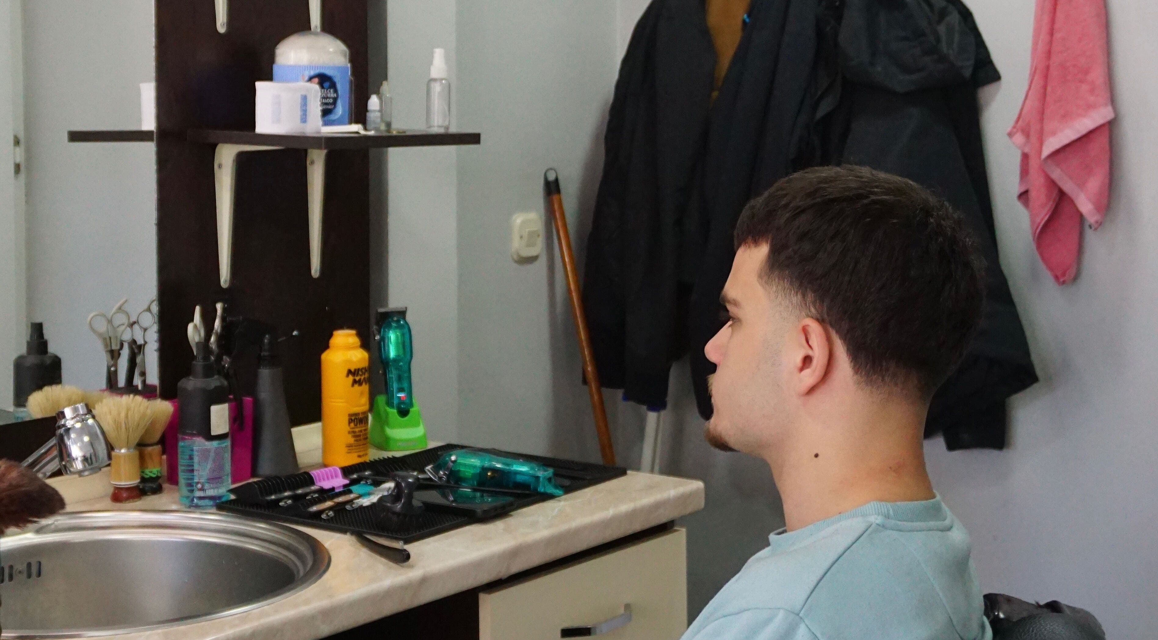 Gentleman enjoying a haircut at Studio Kral, Ohrid, Municipality Of Ohrid, MK.