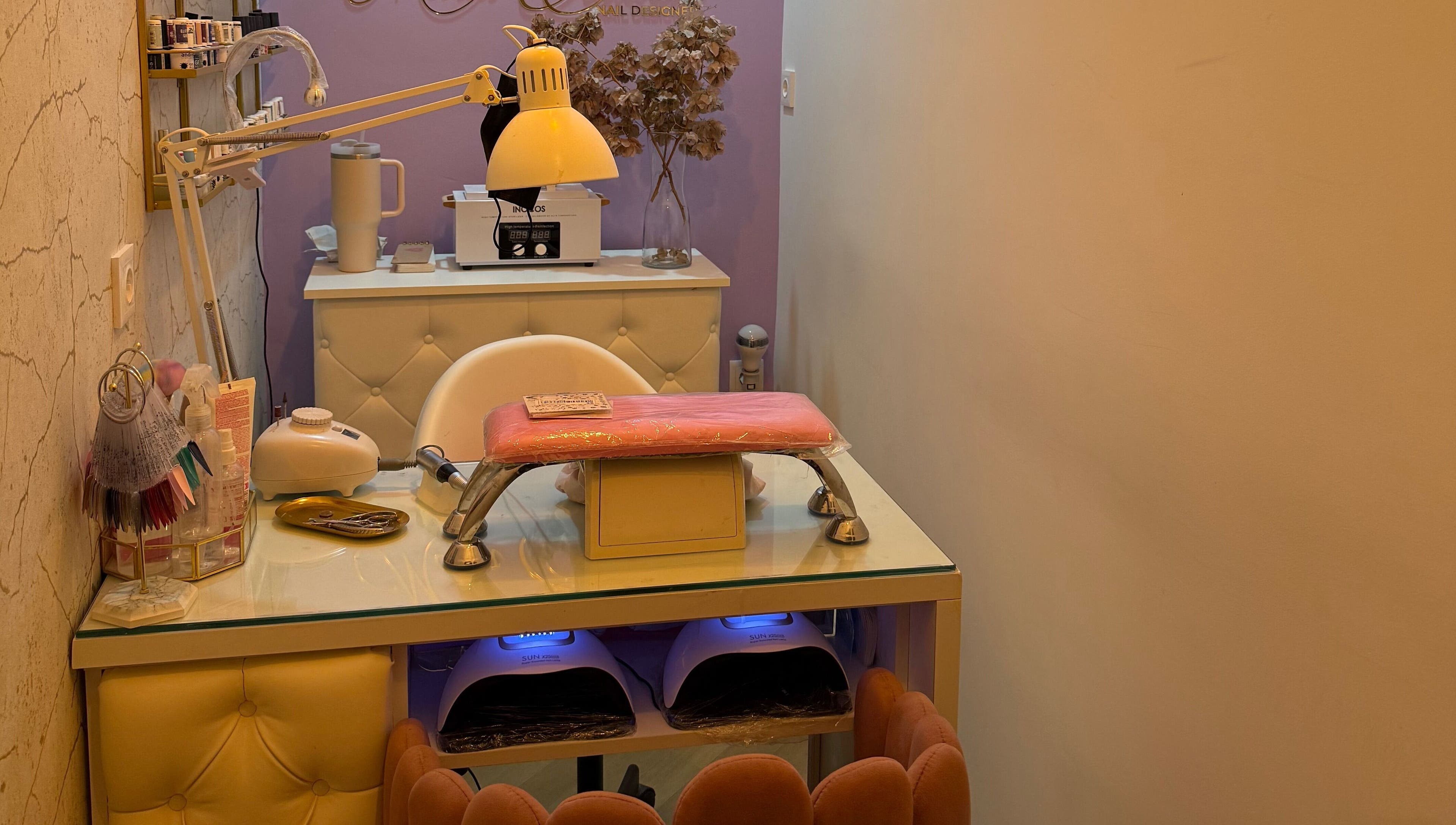 Cozy nail station at Maria Eduarda Nails, featuring tools and decor in Lisboa, Lisboa, PT.