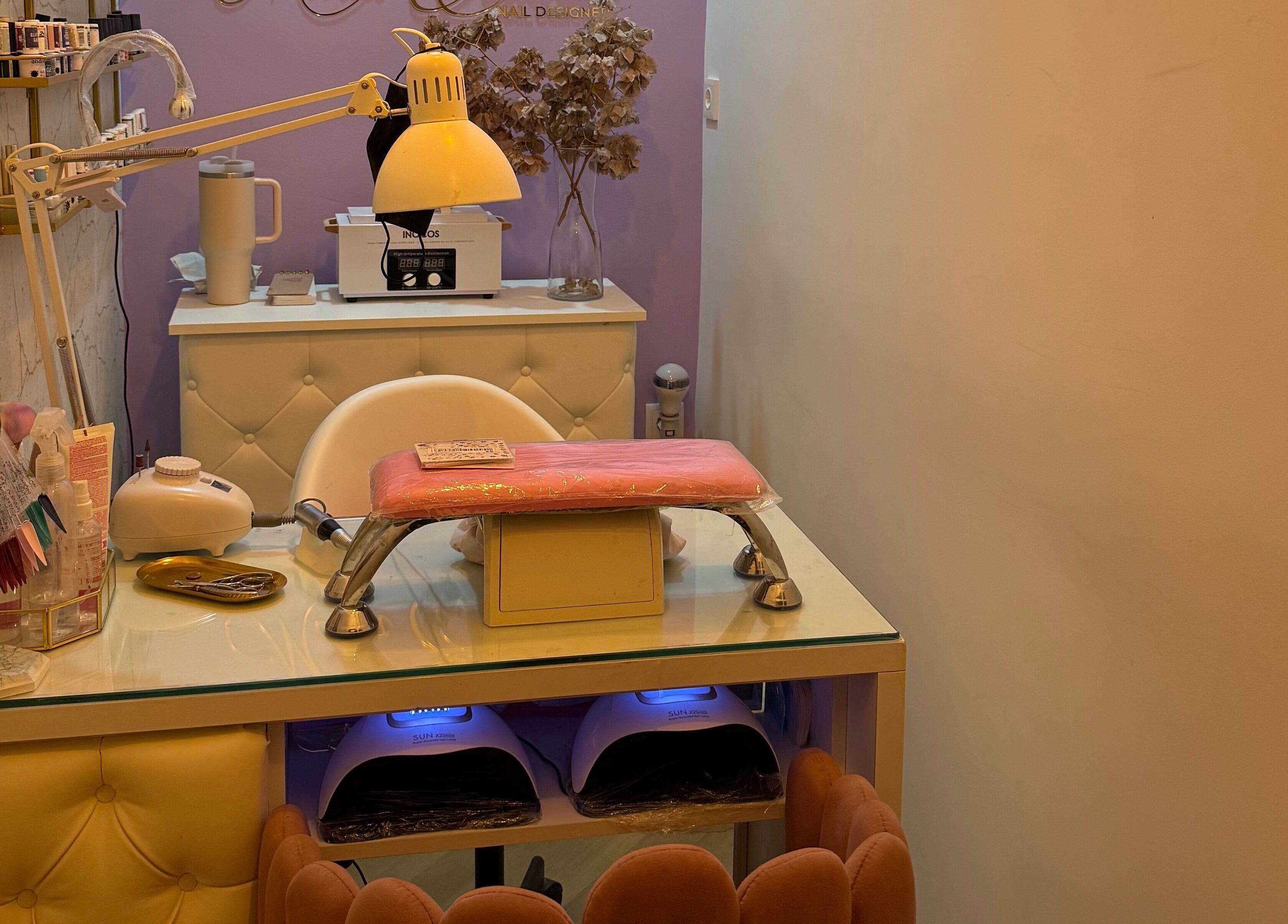 Cozy nail station at Maria Eduarda Nails, featuring tools and decor in Lisboa, Lisboa, PT.