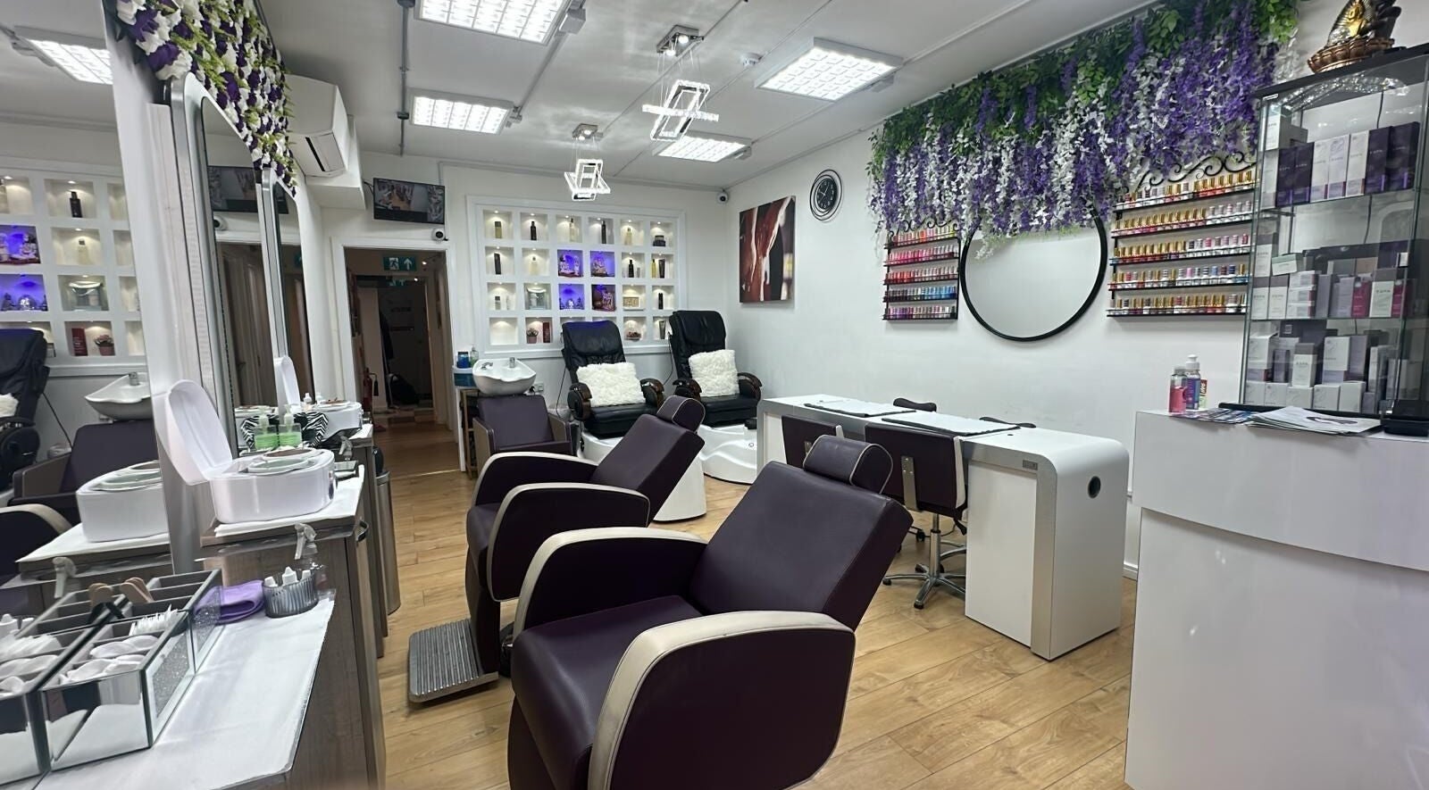 Elegant interior of Lavish Beauty Spa in London, England, GB showcasing plush chairs and vibrant decor.