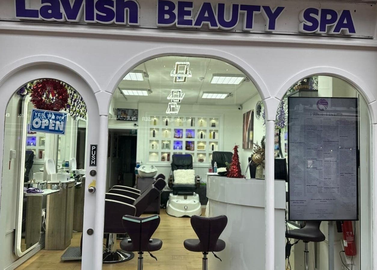 Entrance of Lavish Beauty Spa in London, England, GB showing elegant interior decor and salon chairs.