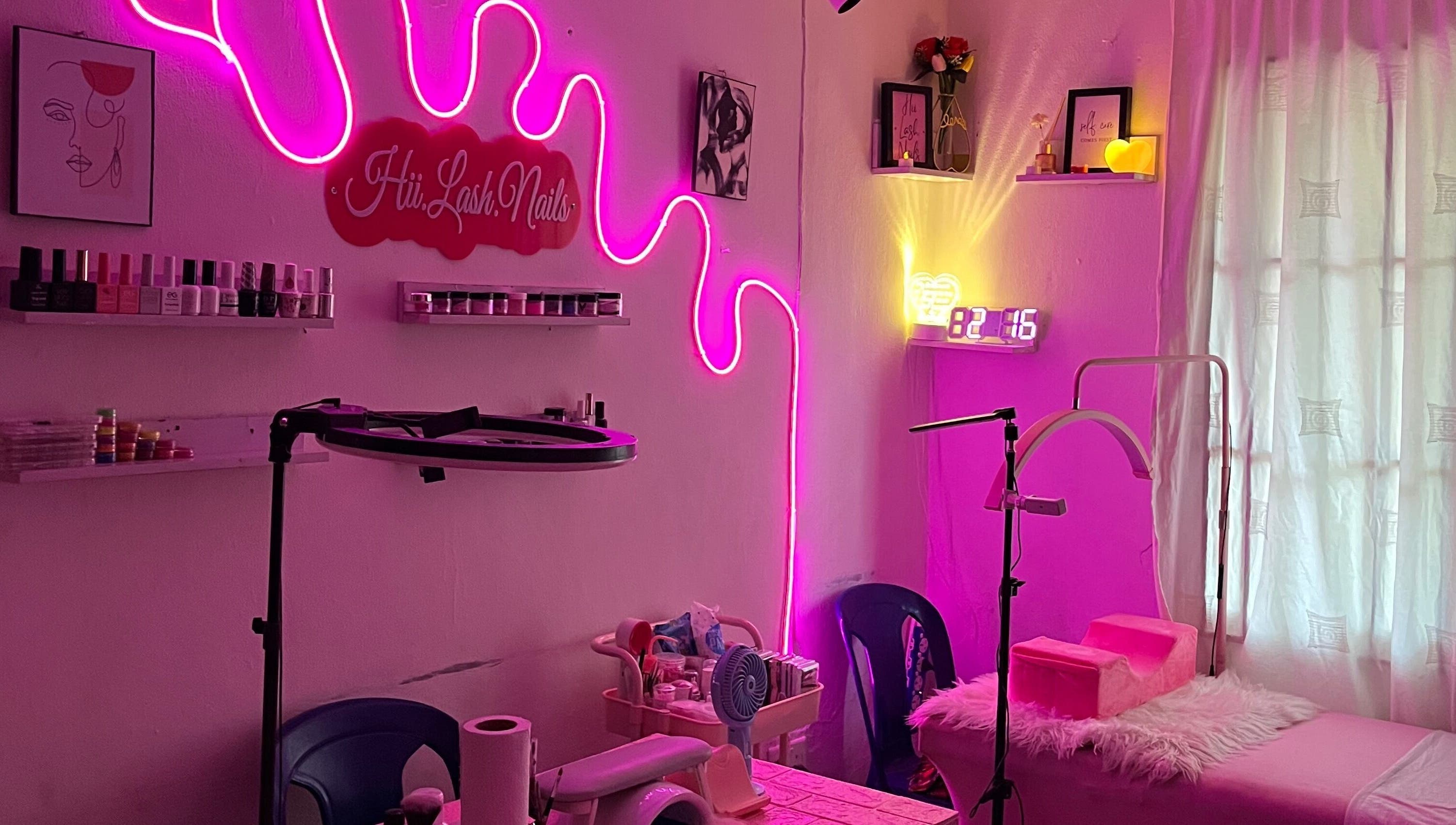 Chic neon-lit salon at HII.LASH.NAILS, Lagos, Lagos, NG, offering beauty and wellness services.
