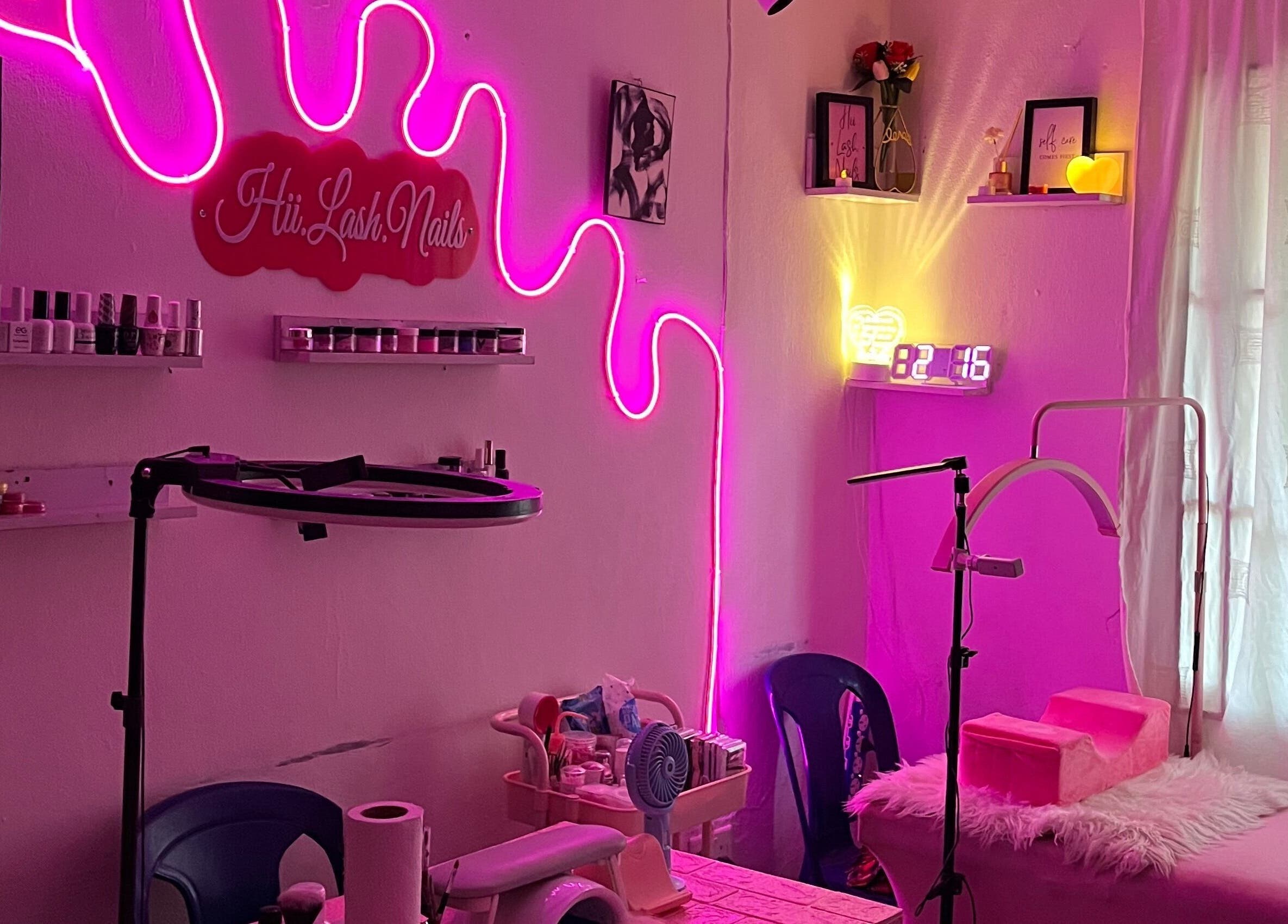 Chic neon-lit salon at HII.LASH.NAILS, Lagos, Lagos, NG, offering beauty and wellness services.