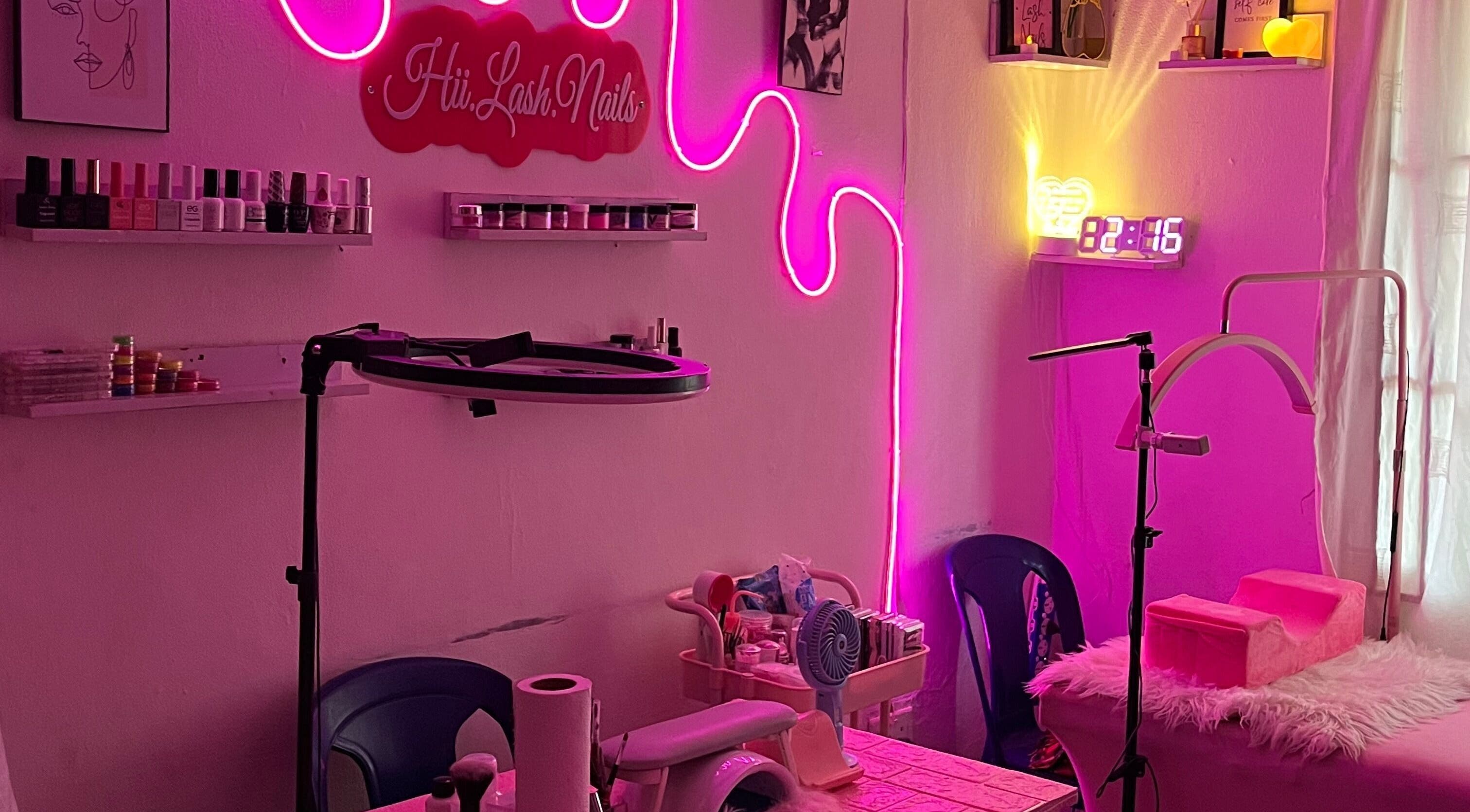 Chic setup at HII.LASH.NAILS, Lagos, Lagos, NG with neon lights and beauty equipment.