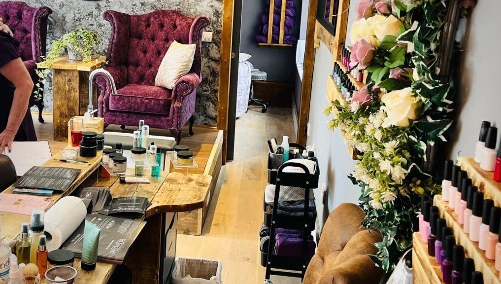 Cozy treatment area at Rènü Dermatology: Aesthetics & Beauty in Lymington, England, GB with velvet chairs.