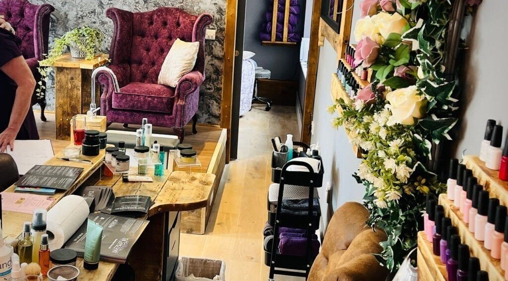 Cozy treatment area at Rènü Dermatology: Aesthetics & Beauty in Lymington, England, GB with velvet chairs.