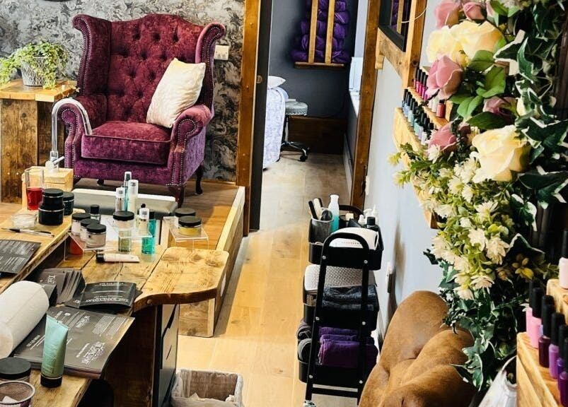 Cozy interior of Rènü Dermatology: Aesthetics & Beauty in Lymington, England, GB featuring luxurious seating and products.