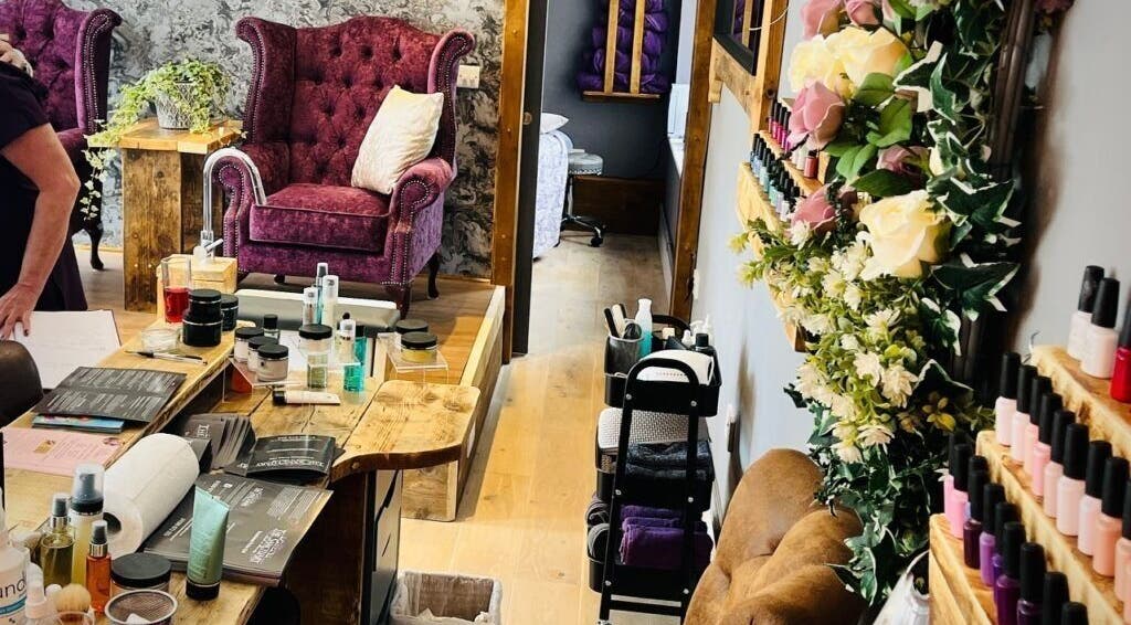 Cozy interior of Rènü Dermatology: Aesthetics & Beauty in Lymington, England, GB featuring luxurious seating and products.