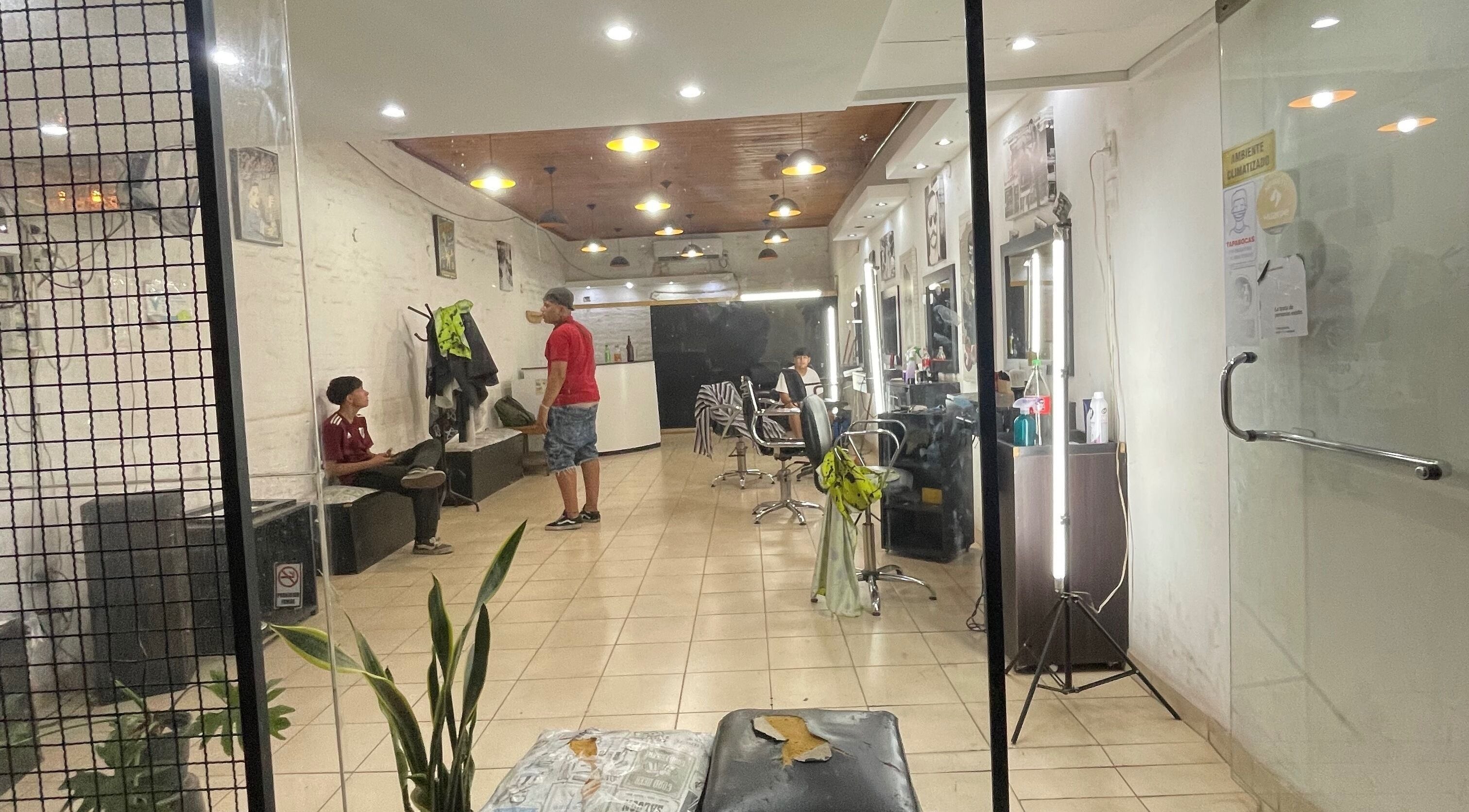 Interior of Lean Barber in Villa Krause, San Juan, AR, showcasing modern seating and ambient lighting.