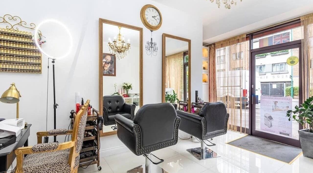 Elegant salon chairs and mirrors at TT Hair And Beauty Academy, London, England, GB with modern decor.