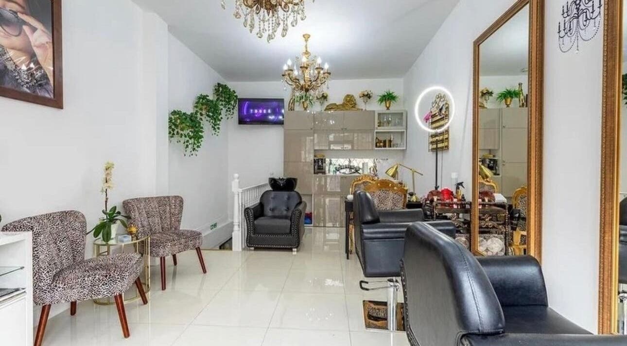 Chic interior of TT Hair And Beauty Academy in London, England, GB with stylish seating and decor.