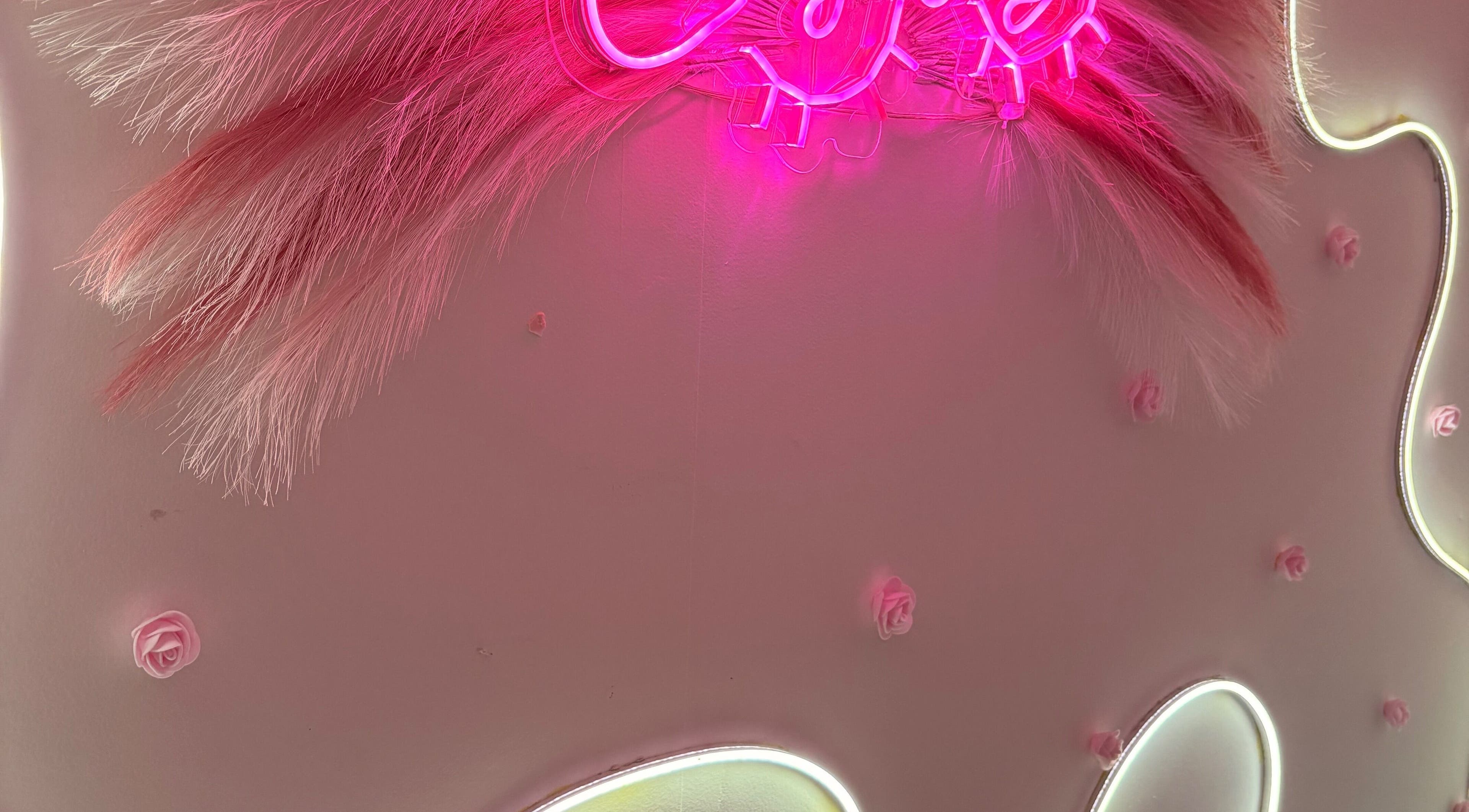 Vibrant pink neon lights adorn Bella Donna, Estado De México, Estado De México, MX, creating a stylish ambiance.