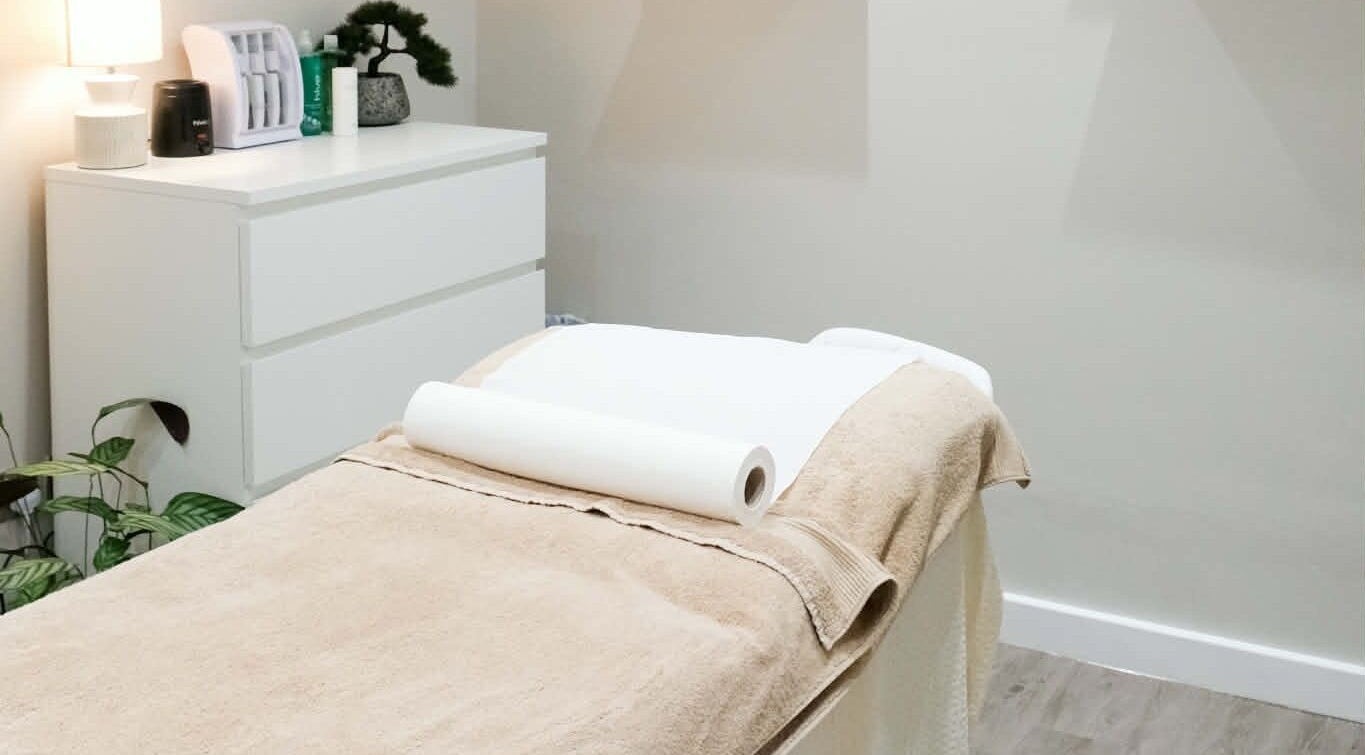 Elegant treatment room at Kaye at Nova, Clitheroe, England, GB, with a cozy massage table.