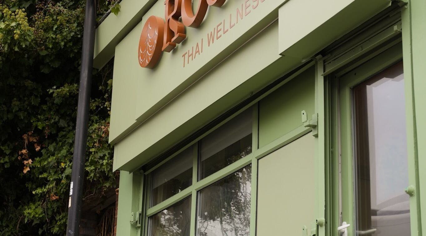 Front view of Roukh Thai Wellness Prestwich, a tranquil green building in Manchester, England, GB.