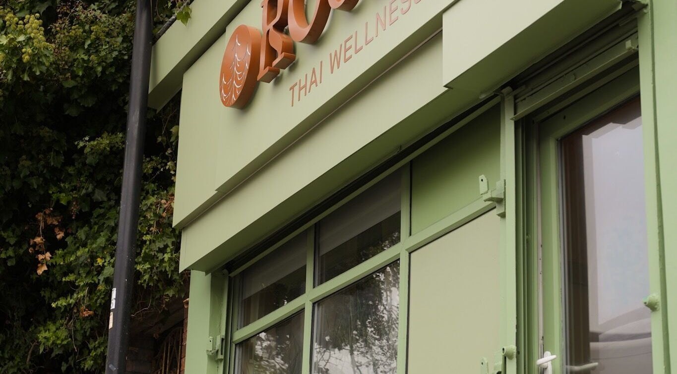 Front view of Roukh Thai Wellness Prestwich, a tranquil green building in Manchester, England, GB.