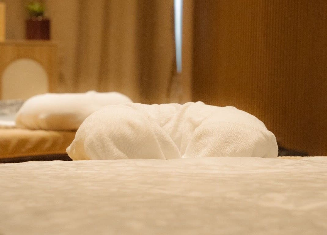 Massage mat with rolled towel at Roukh Thai Wellness Prestwich, Manchester, England, GB.