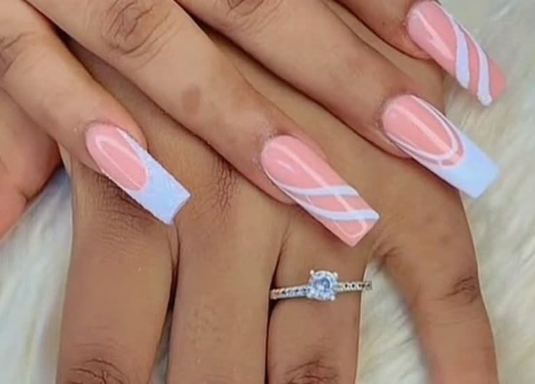 Stylish pink and white nail art at RANAKA BEAUTY SALON, Cape Town, Western Cape, ZA showcasing elegance.