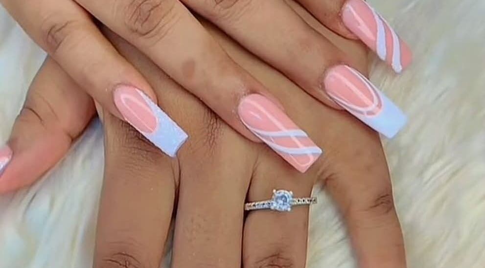 Stylish pink and white nail art at RANAKA BEAUTY SALON, Cape Town, Western Cape, ZA showcasing elegance.