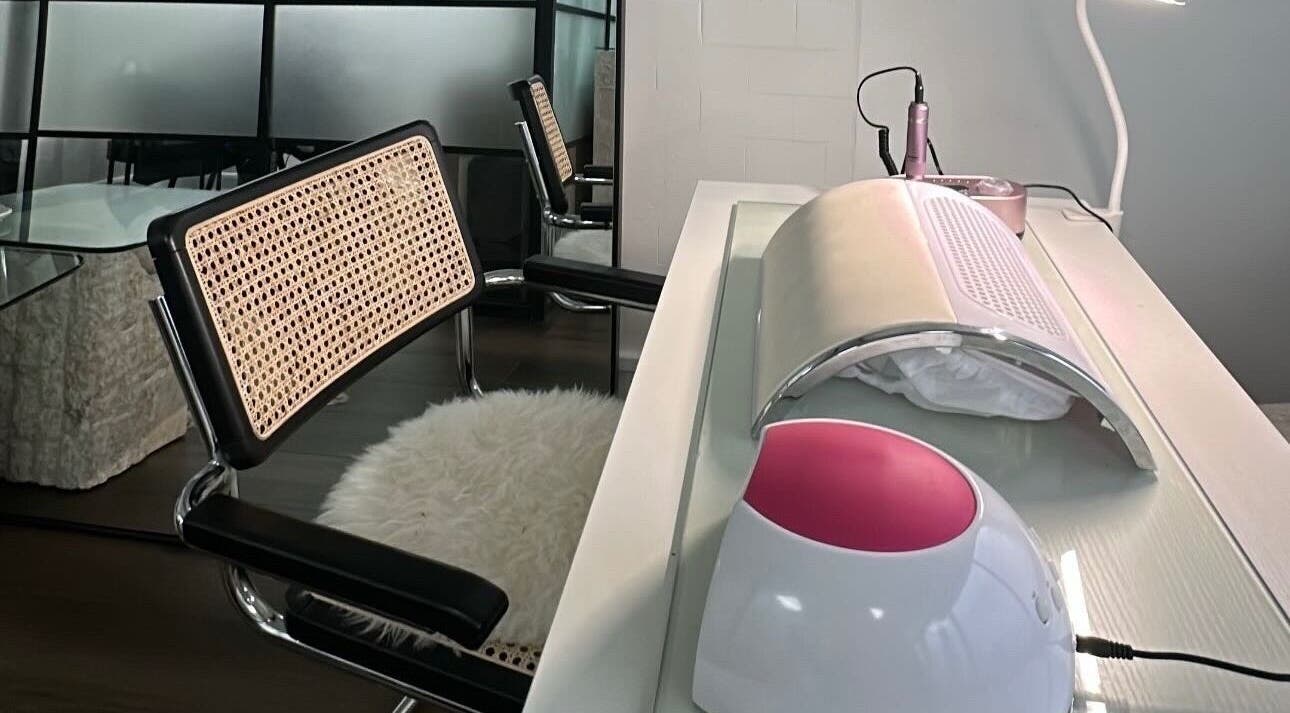 Modern nail salon setup at Jo Nails in Coventry, England, GB showcasing stylish seating and manicure stations.