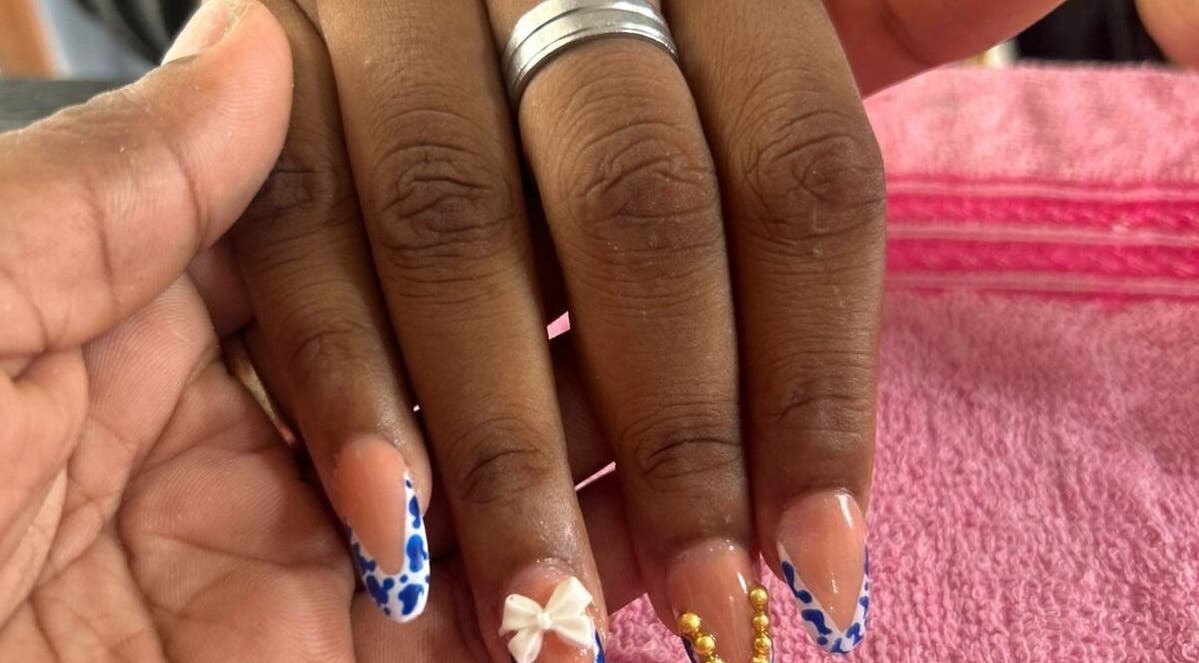Elegant nail art with bows and beads at Creative Theia in Georgetown, Demerara-Mahaica, GY.