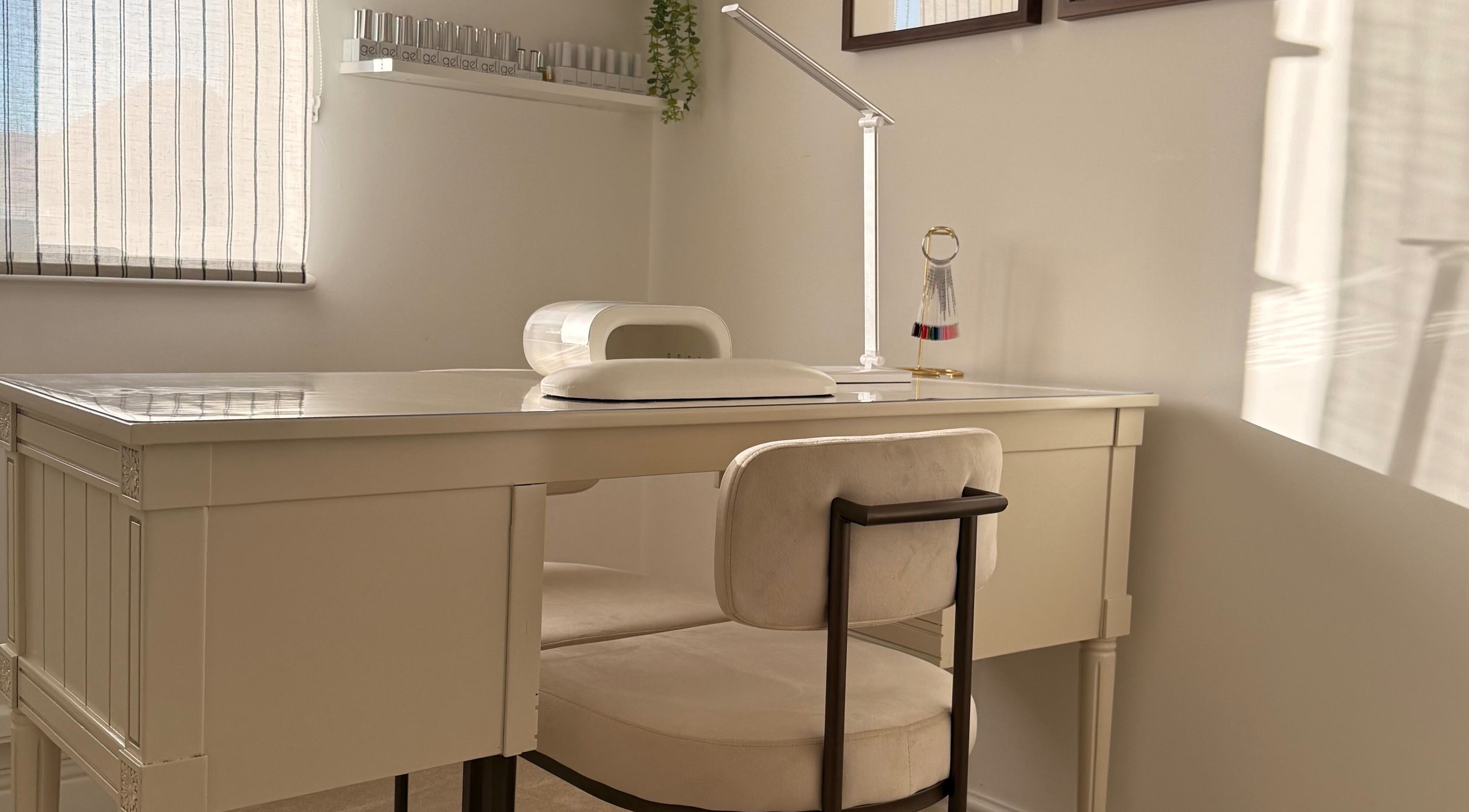 Cozy nail station at VD Nail Artist in Witham, England, GB with chic decor and bright lighting.