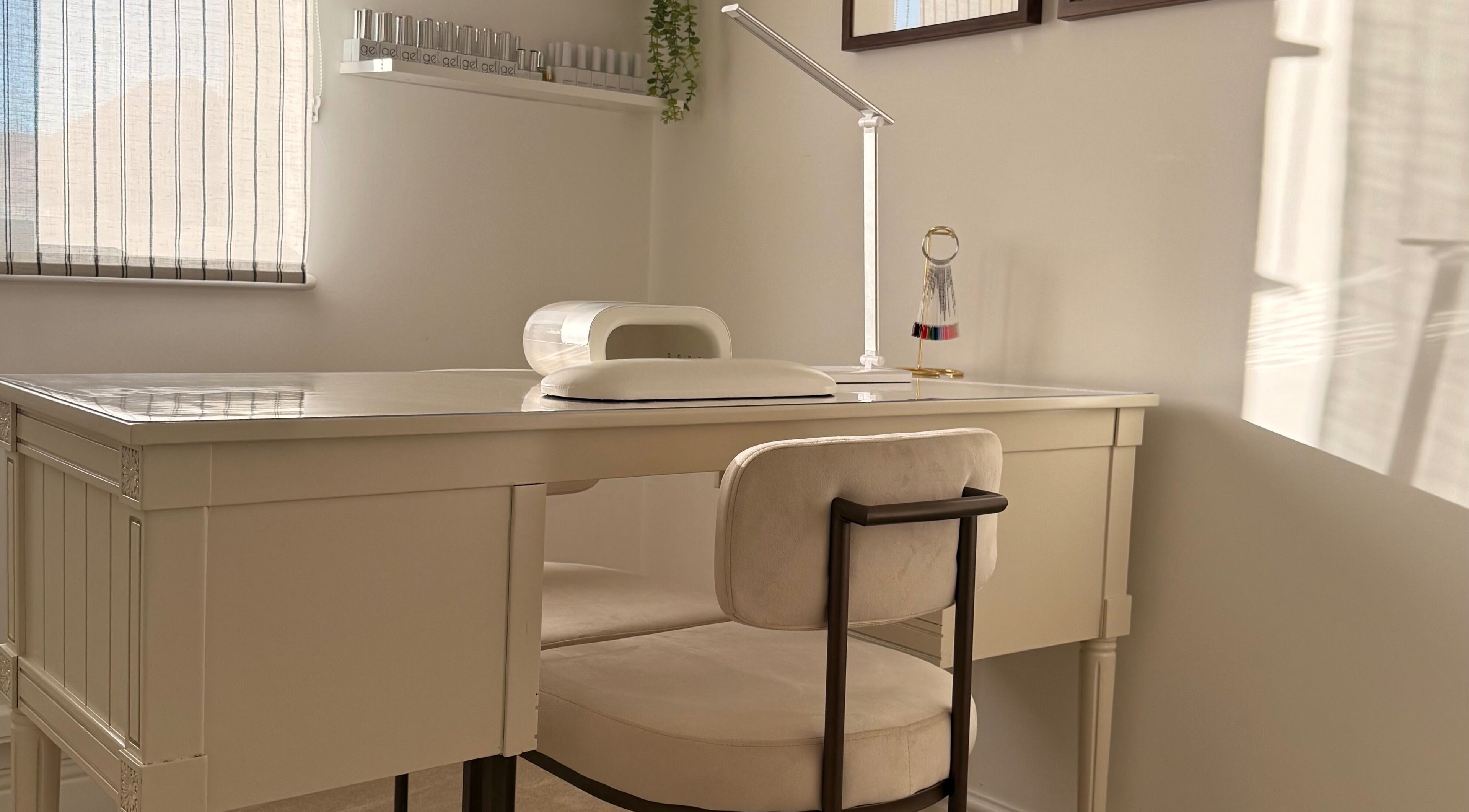 Cozy nail station at VD Nail Artist in Witham, England, GB with chic decor and bright lighting.