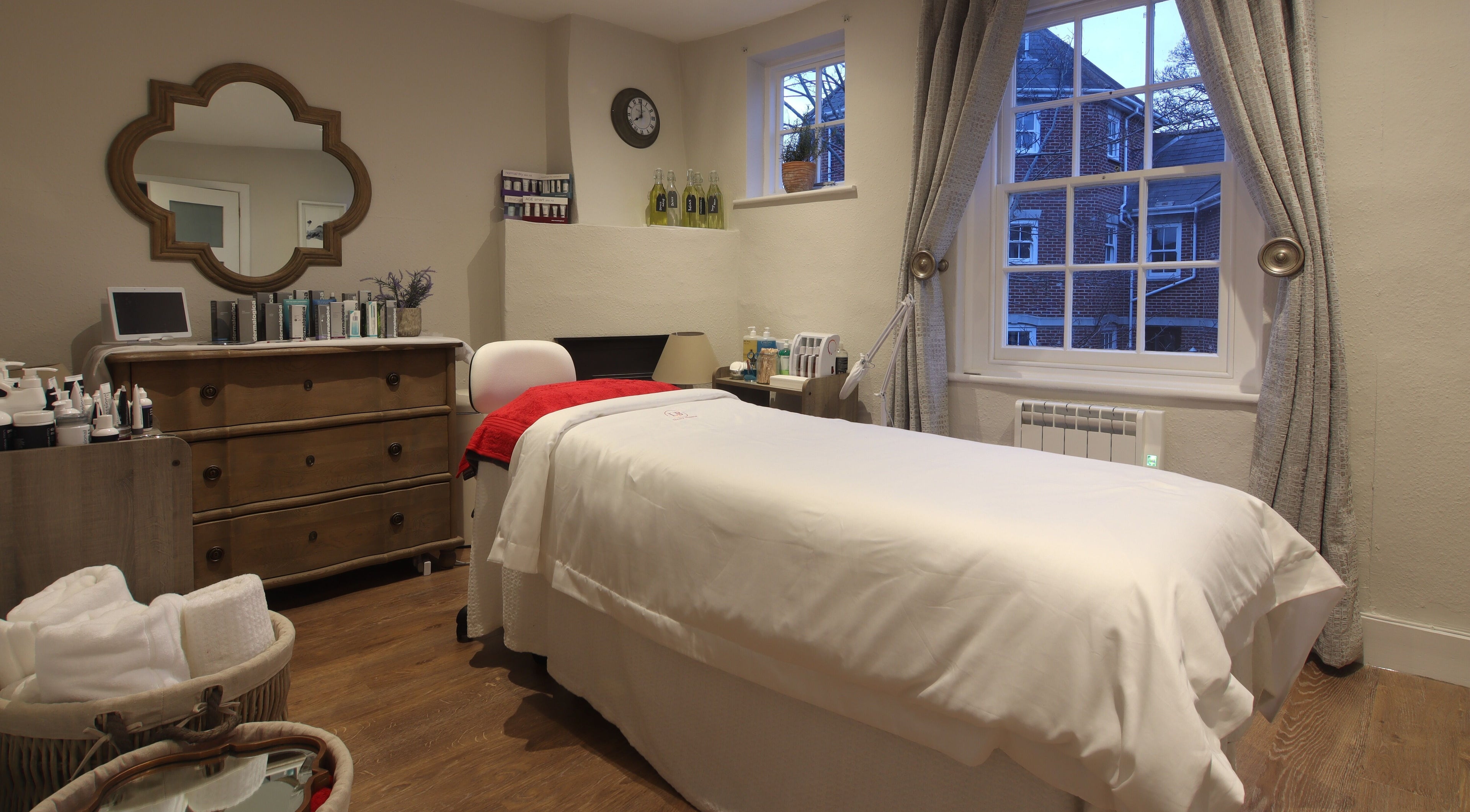 Relaxing treatment room at Luxury Bubble Fordingbridge, Fordingbridge, England, GB, featuring a cozy bed.