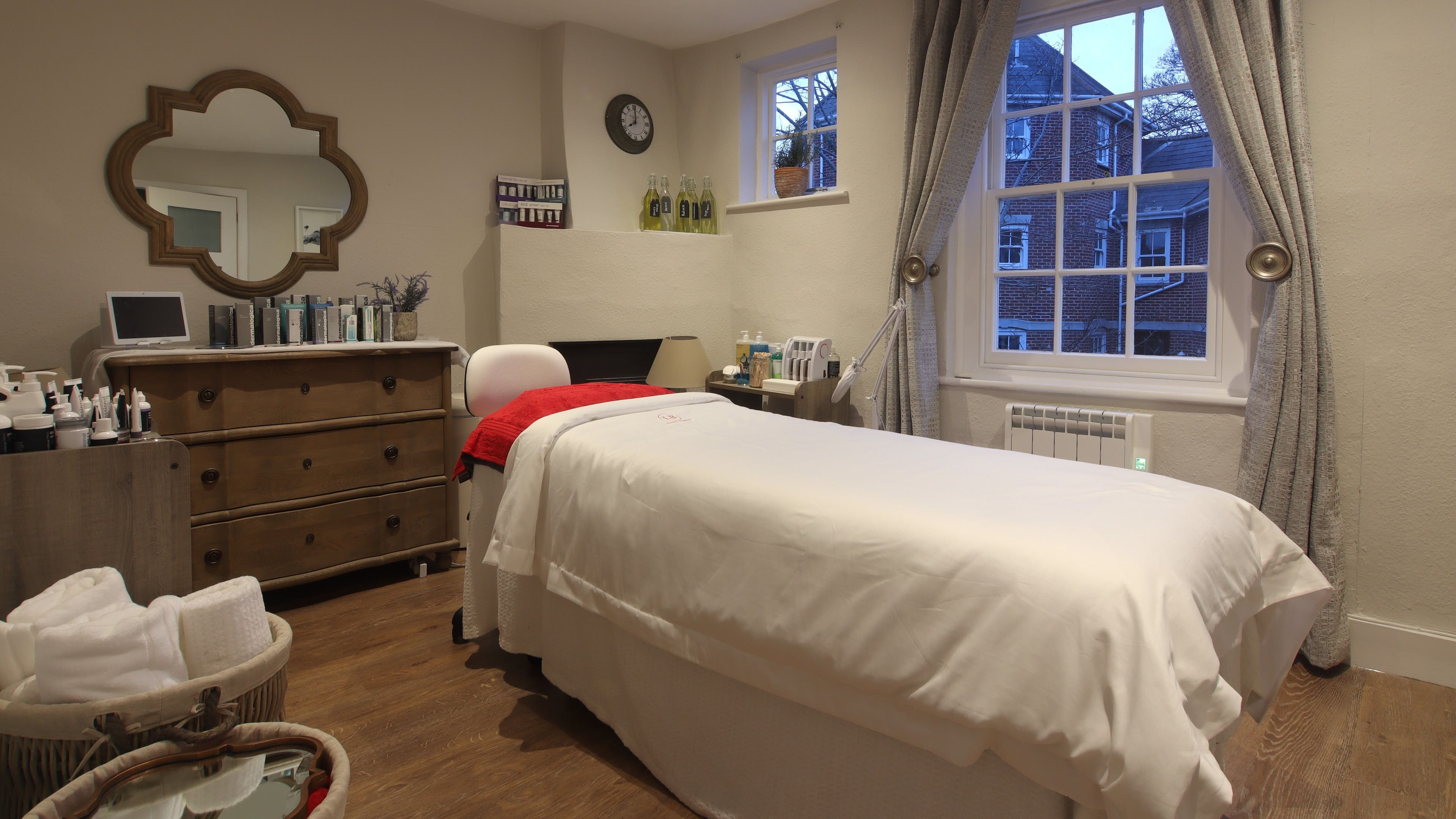 Relaxing treatment room at Luxury Bubble Fordingbridge, Fordingbridge, England, GB, featuring a cozy bed.