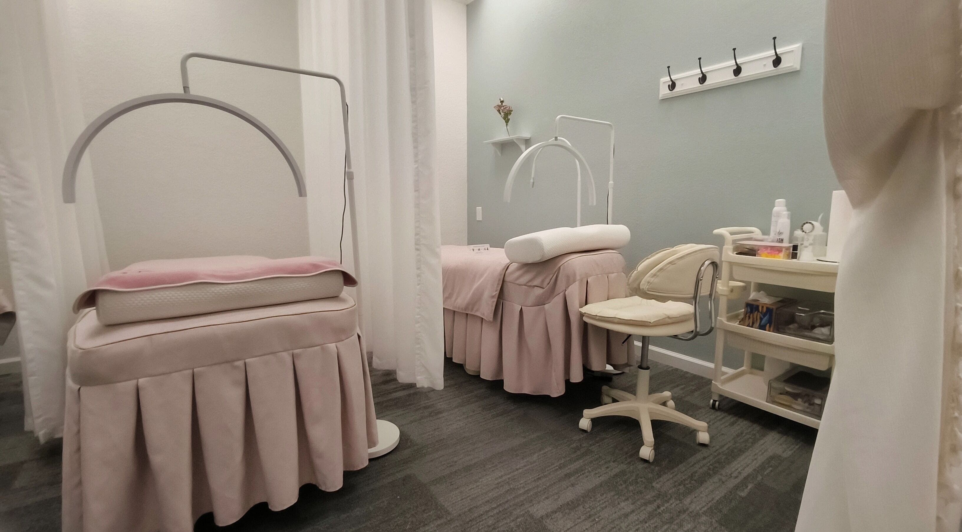 Relaxing treatment area at Catchy EyeDol Lash & Beauty, Fremont, California, US, with plush beds and soft decor.