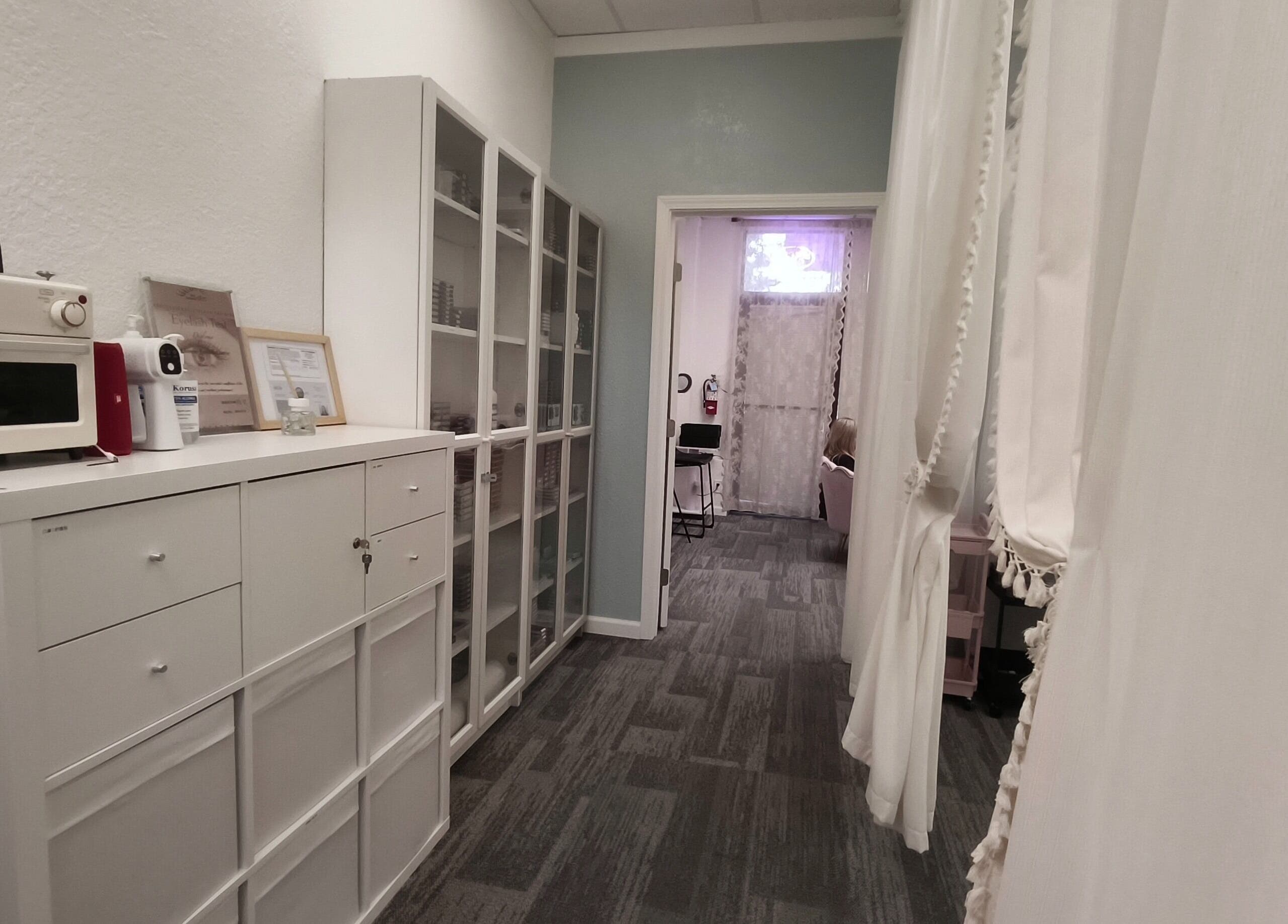 Chic hallway at Catchy EyeDol Lash & Beauty in Fremont, California, US with elegant decor and storage.