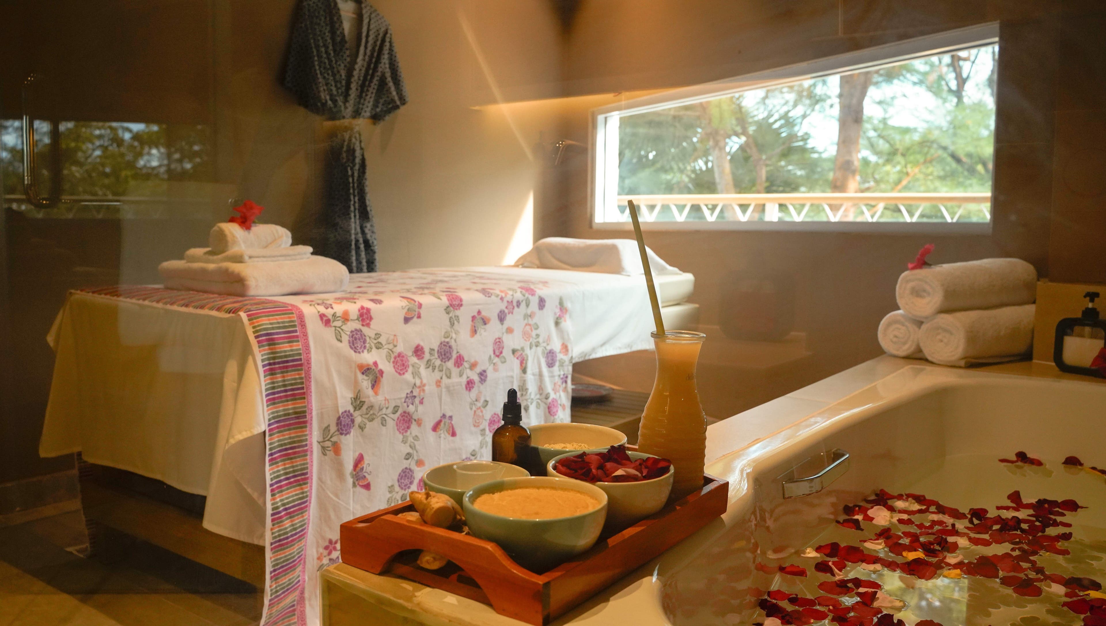 Tranquil Aspa room in Kepulauan Riau, ID, with massage table, fresh towels, and aromatic essentials.
