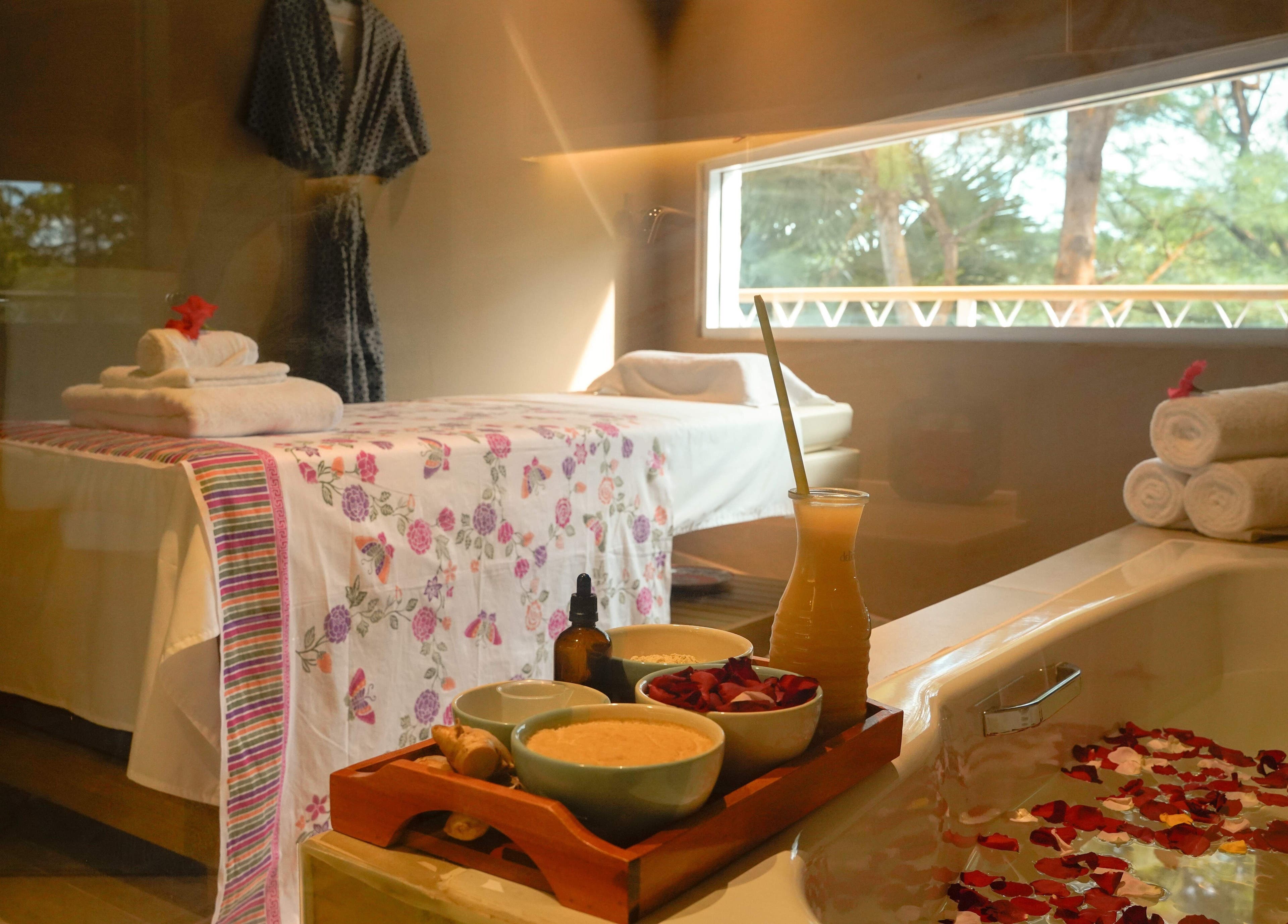 Tranquil Aspa room in Kepulauan Riau, ID, with massage table, fresh towels, and aromatic essentials.