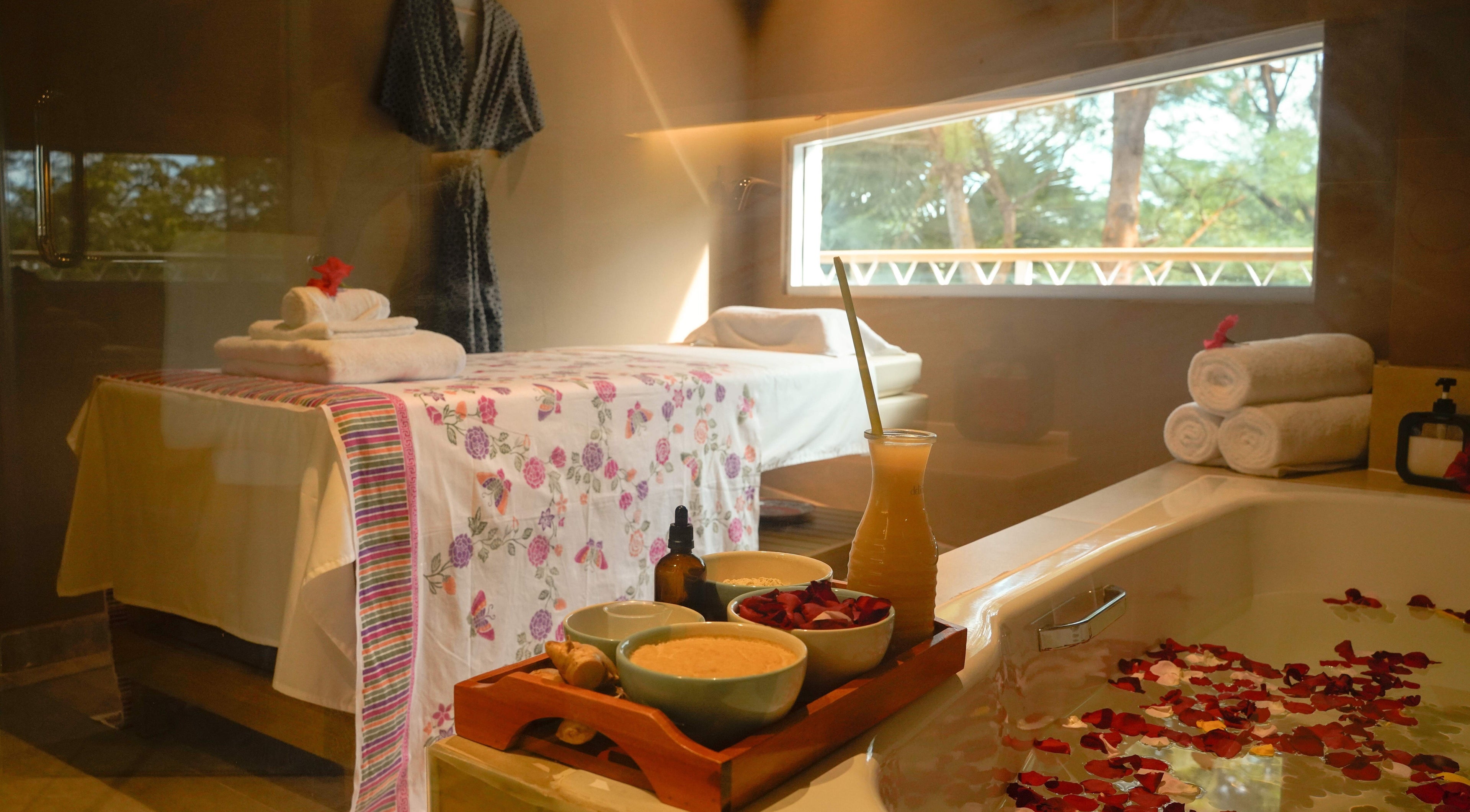 Tranquil Aspa room in Kepulauan Riau, ID, with massage table, fresh towels, and aromatic essentials.