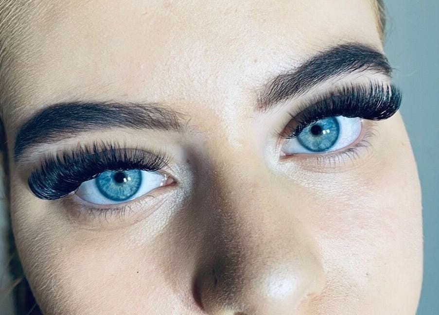 Close-up of vibrant blue eyes with enhanced lashes at Haute Lash and Brow, Melbourne, Victoria, AU.