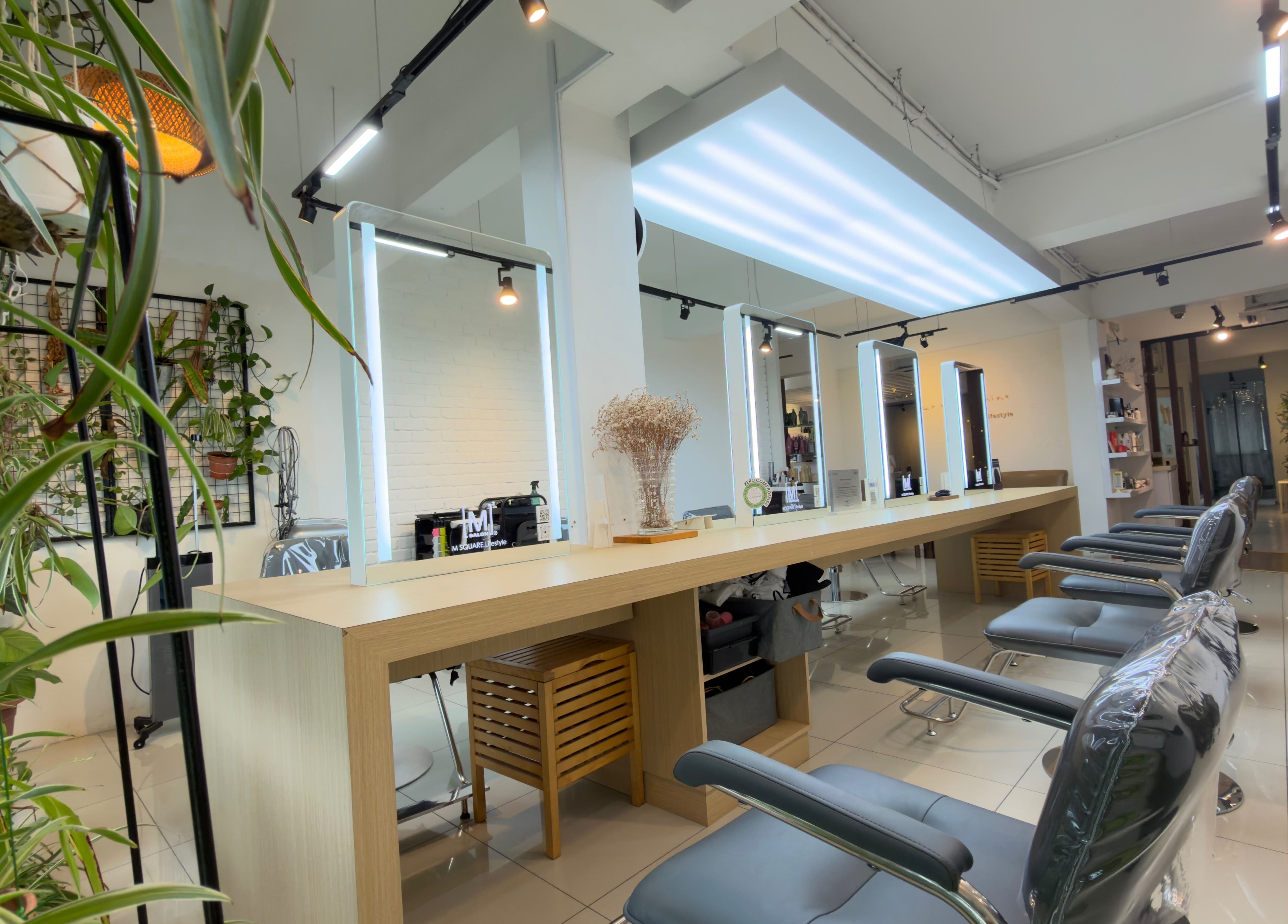 Stylish interior of M Square Lifestyle Salon HQ in Puchong, Selangor, MY with modern chairs and mirrors.
