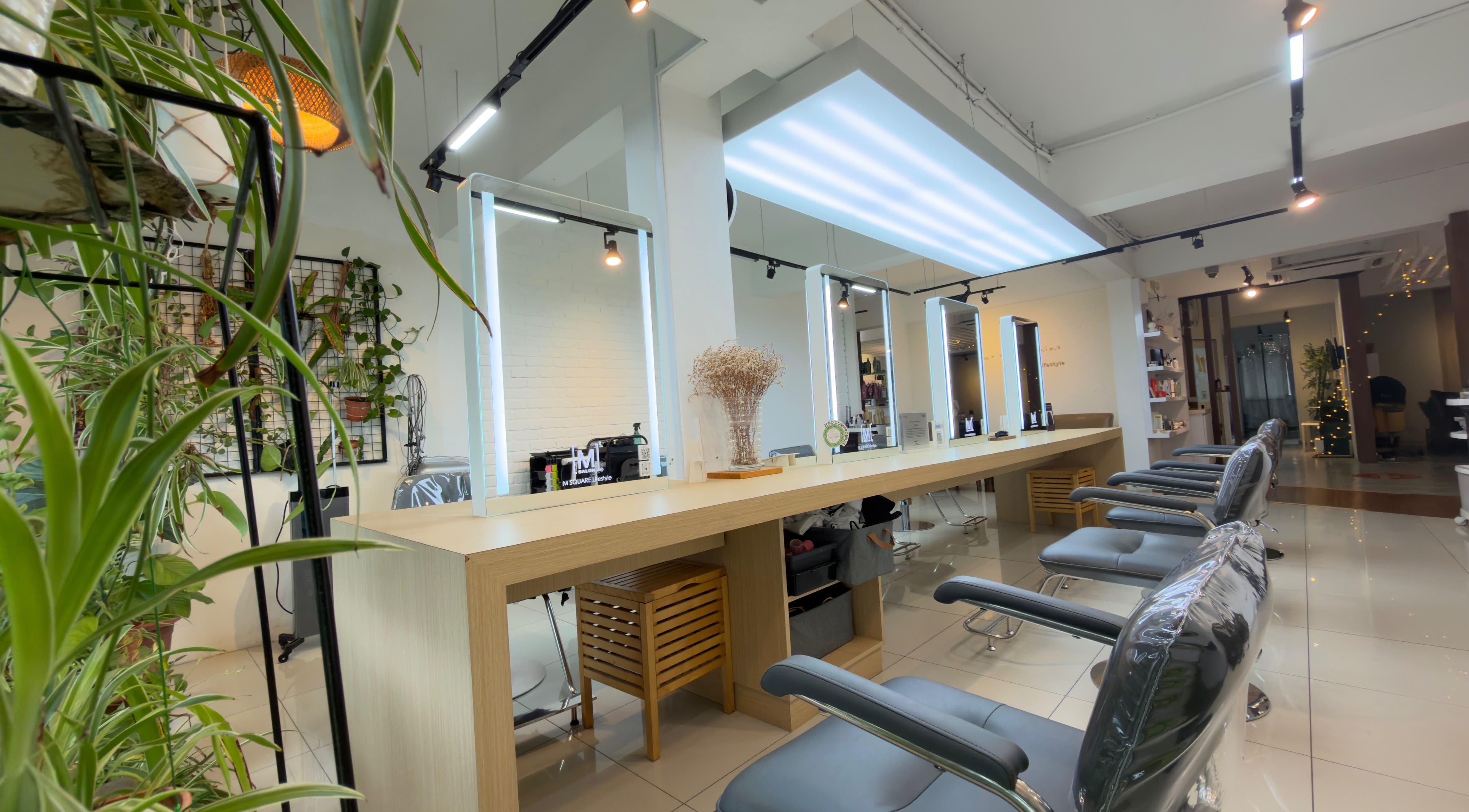 Stylish interior of M Square Lifestyle Salon HQ in Puchong, Selangor, MY with modern chairs and mirrors.