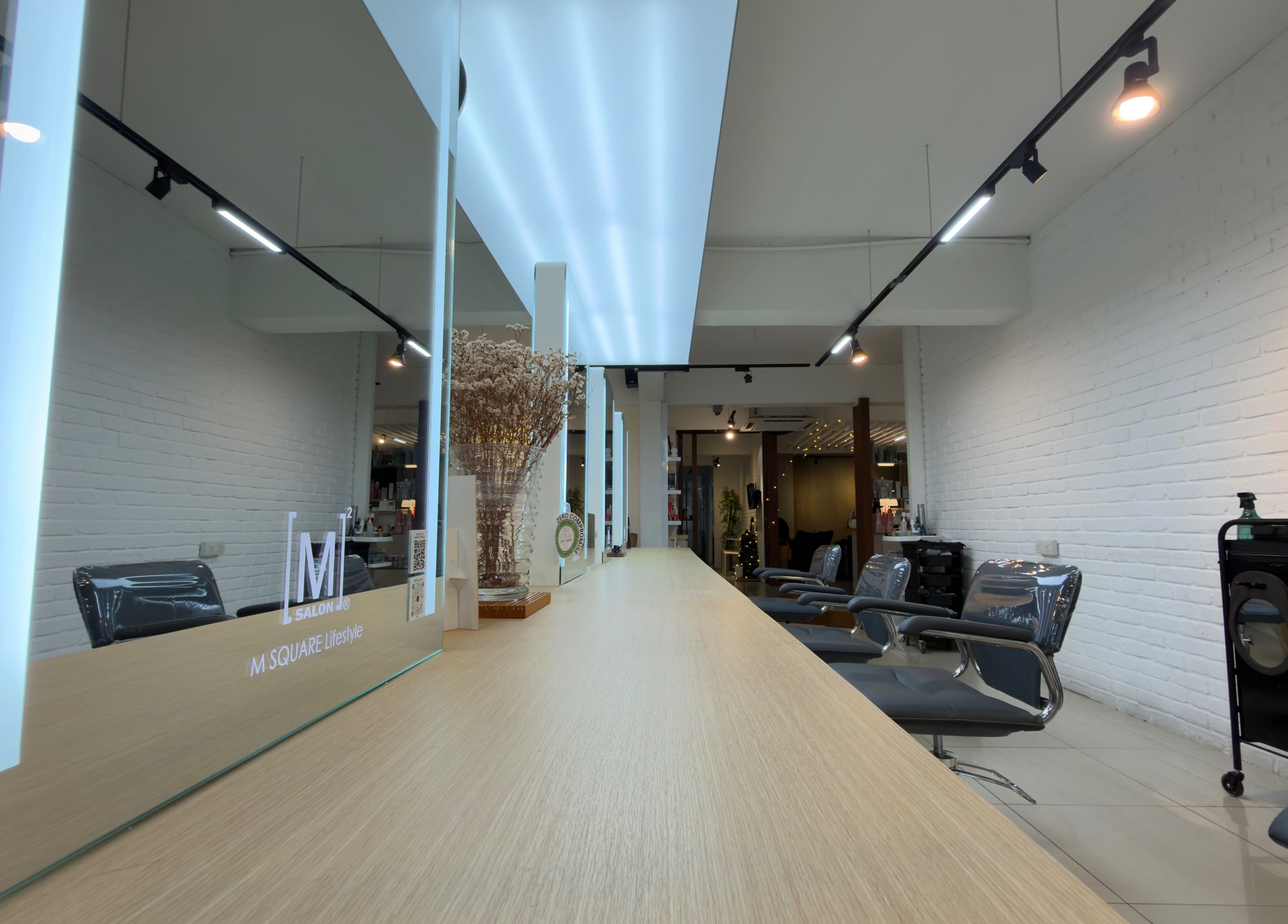 Modern interior of M Square Lifestyle Salon HQ in Puchong, Selangor, MY showcasing stylish chairs and mirrors.