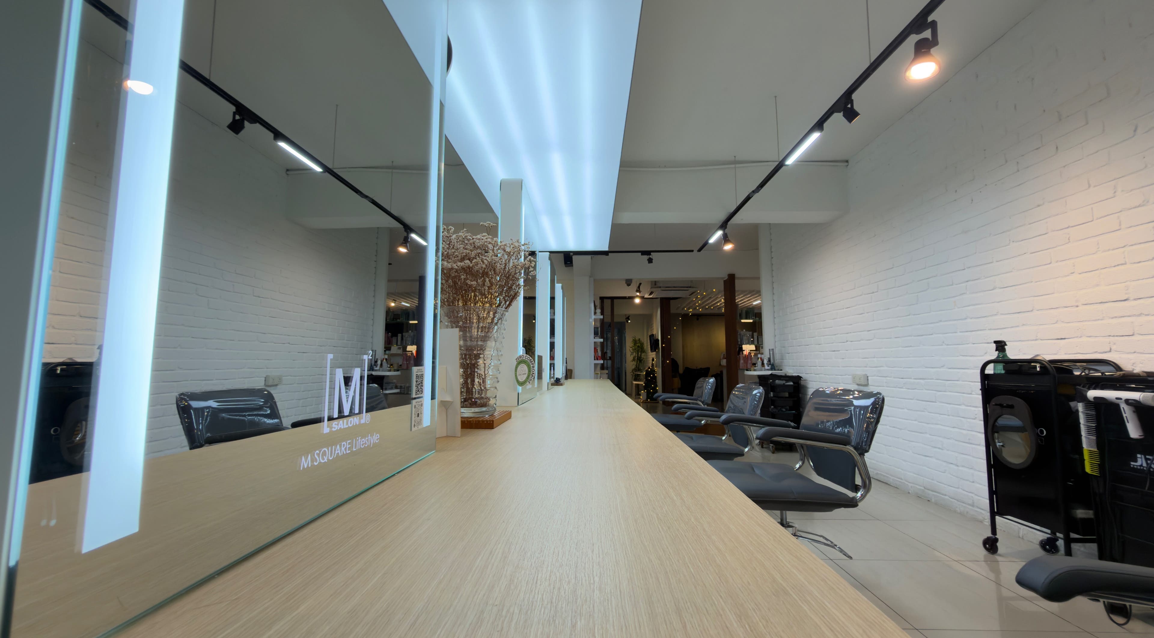 Modern interior of M Square Lifestyle Salon HQ in Puchong, Selangor, MY showcasing stylish chairs and mirrors.