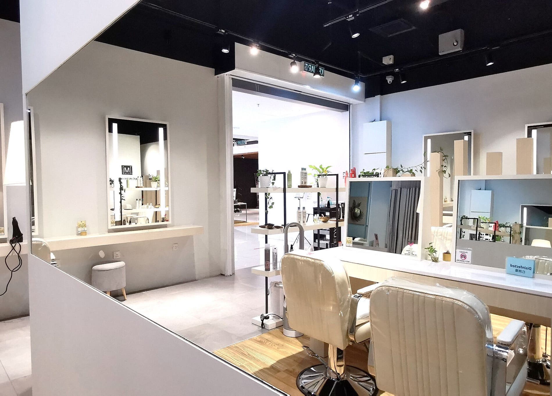 Modern salon interior at M SQUARE LIFESTYLE SALON, Kuala Lumpur, featuring sleek styling stations and mirrors.