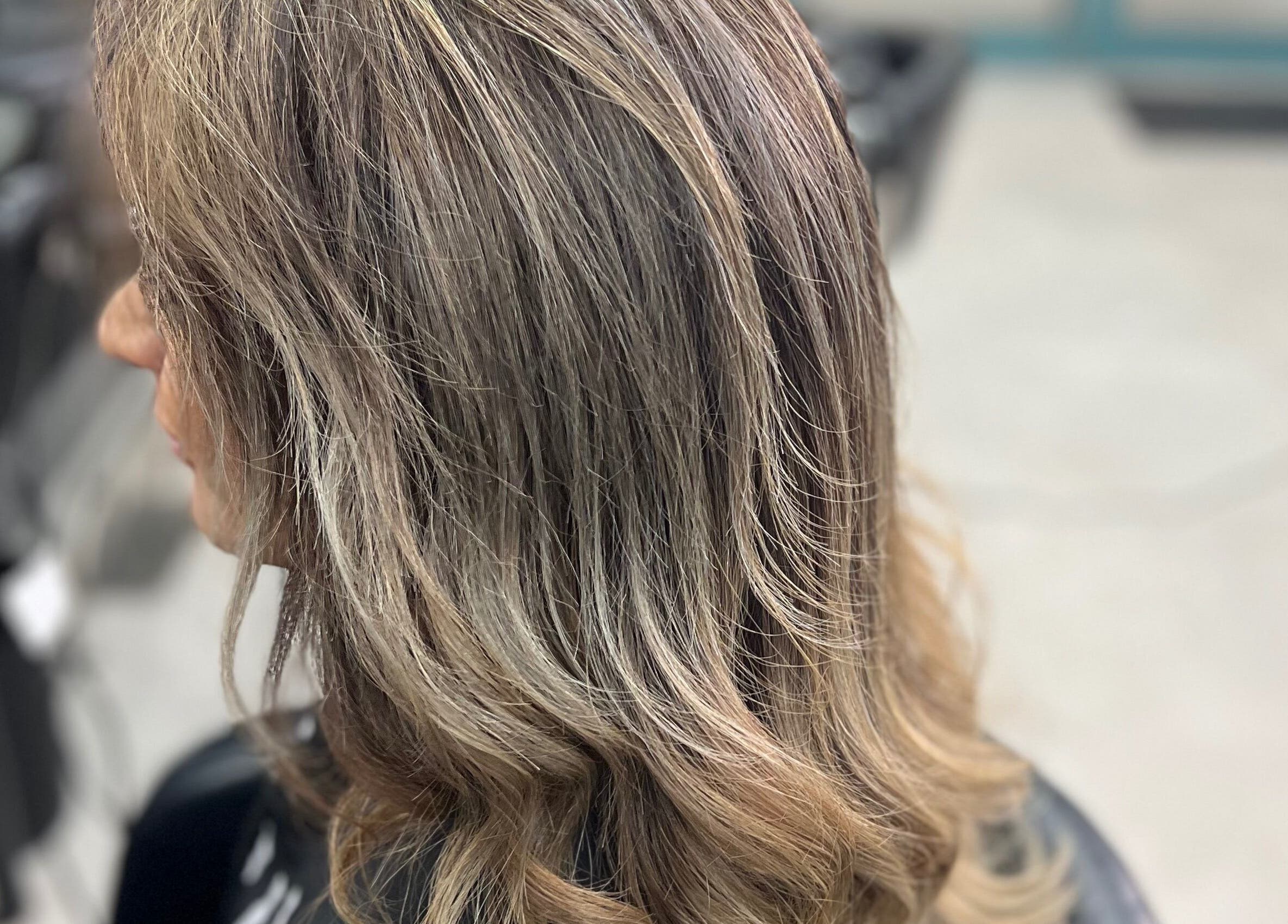 Elegant wavy hairstyle at Hair By Yamen, Melbourne, Victoria, AU, capturing sophisticated beauty.