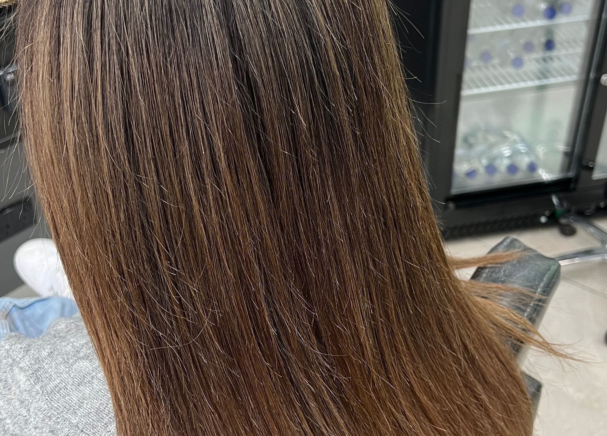 Smooth, silky brunette hair styled at Hair By Yamen in Melbourne, Victoria, AU.