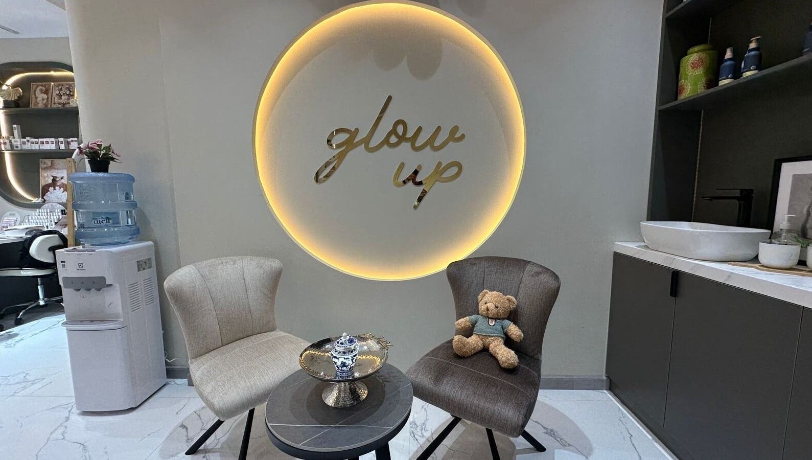 Inviting seating with 'glow up' decor at Allenora Beauty Lounge, Abu Dhabi, AE.