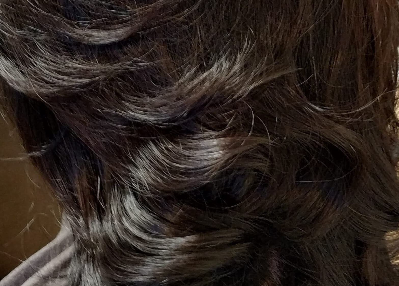 Elegant, styled dark hair at Nicolas Mark hairdressing, Newcastle upon Tyne 5 Saville Place, England, GB.