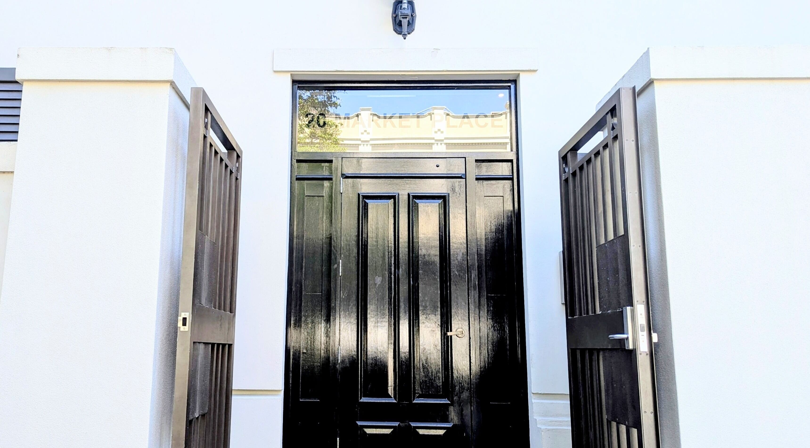 Sleek black door at Total Body Care Salon BLESS, Auckland, Auckland, NZ, with modern design.