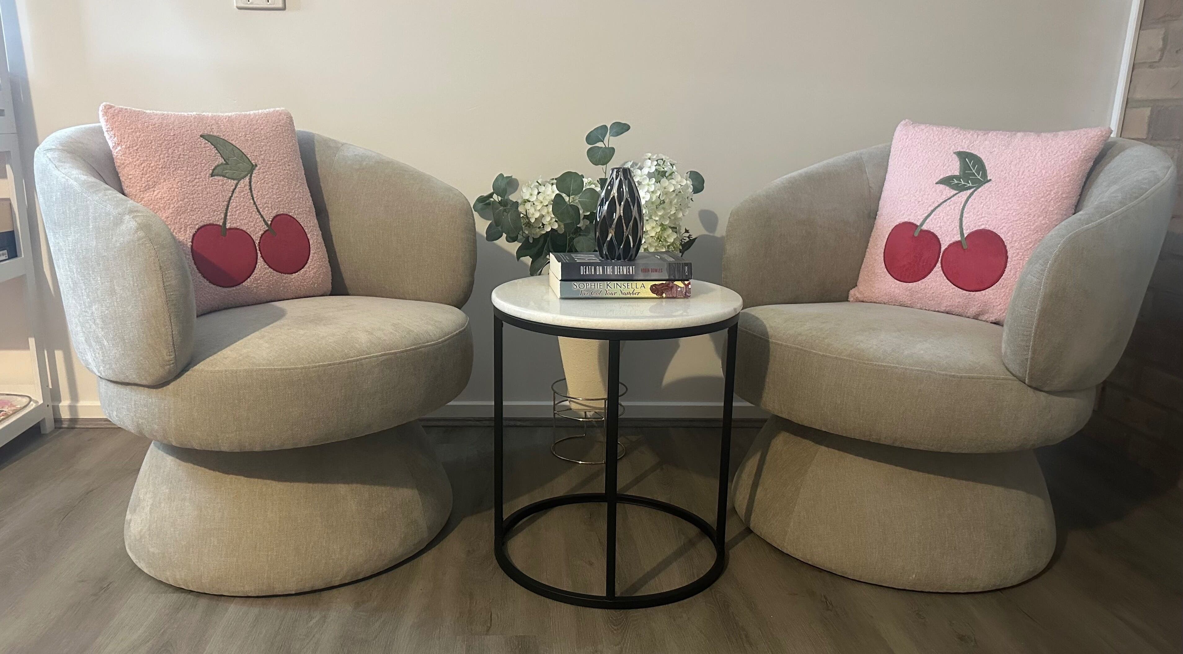 Cozy seating area with pink cherry cushions at Glow By Candice K, Melbourne, Victoria, AU.